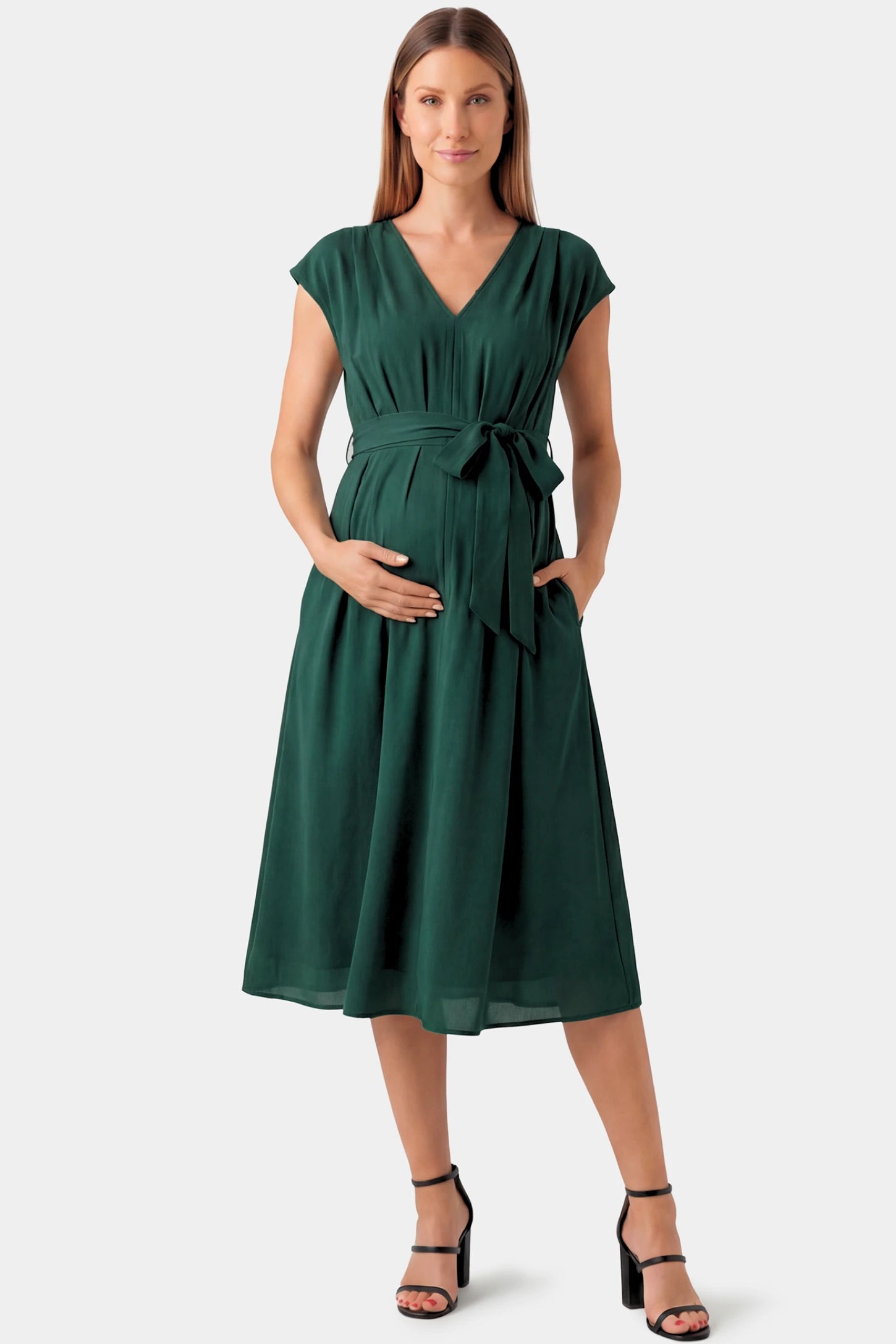 Cap Sleeves Belted Maternity Midi Dress Cap Sleeves Belted Maternity Midi Dress in dark green featuring a V-neckline, cap sleeves, and a self-tie waist belt on a pregnant model.