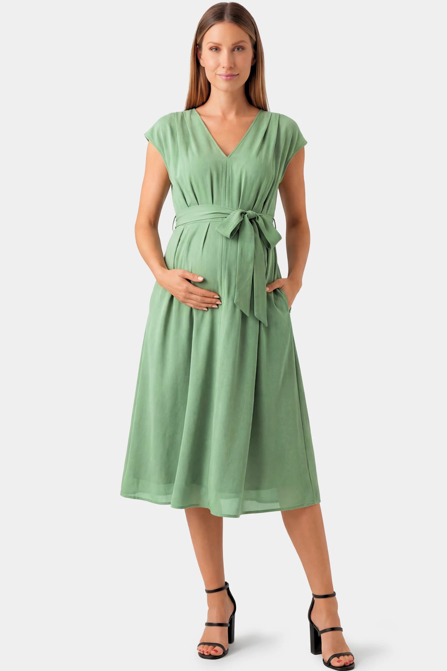 Cap Sleeves Belted Maternity Midi Dress Cap Sleeves Belted Maternity Midi Dress in mint green featuring a V-neckline, cap sleeves, and a self-tie waist belt on a pregnant model.