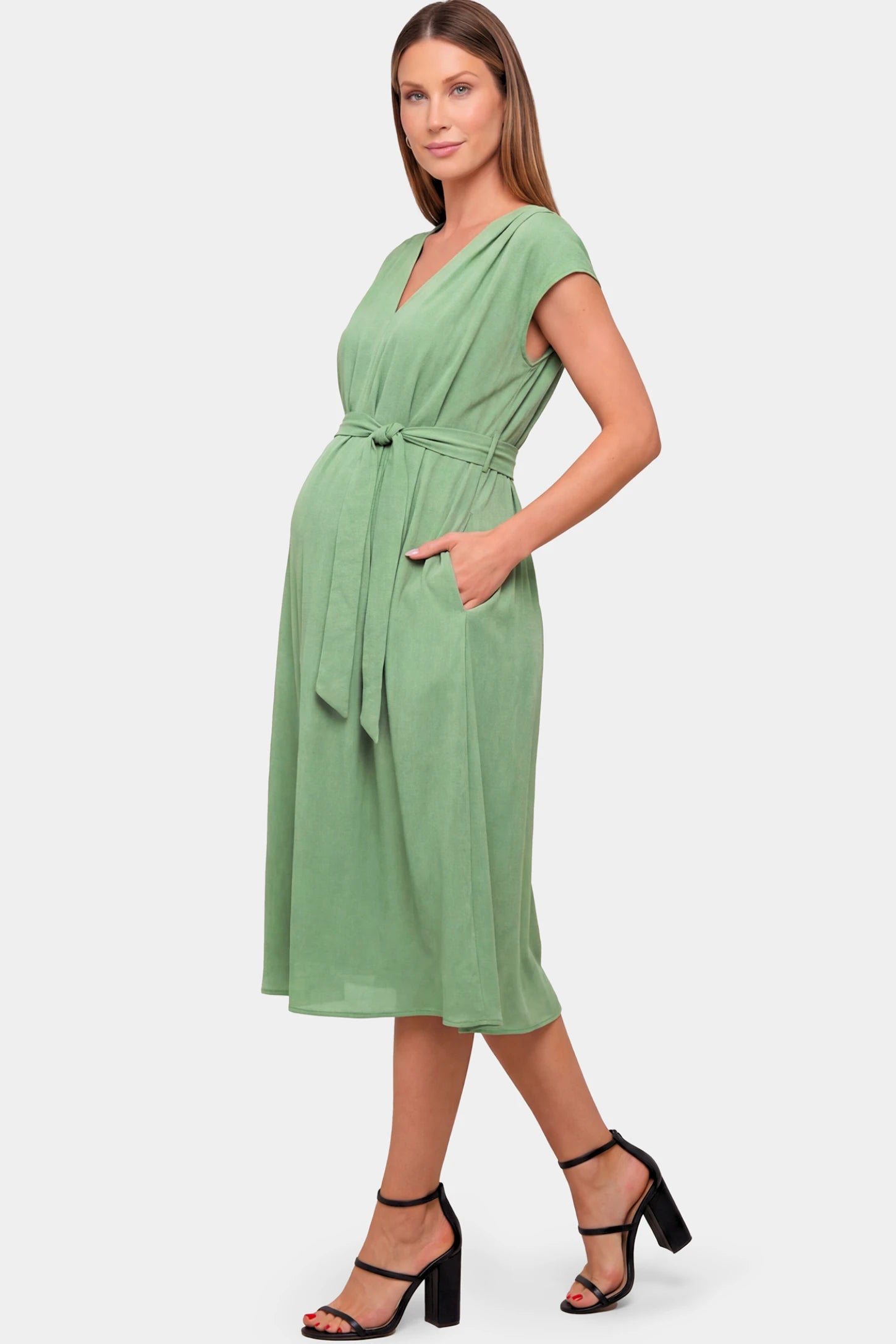 Cap Sleeves Belted Maternity Midi Dress Cap Sleeves Belted Maternity Midi Dress in mint green featuring a V-neckline, cap sleeves, and a self-tie waist belt on a pregnant model.