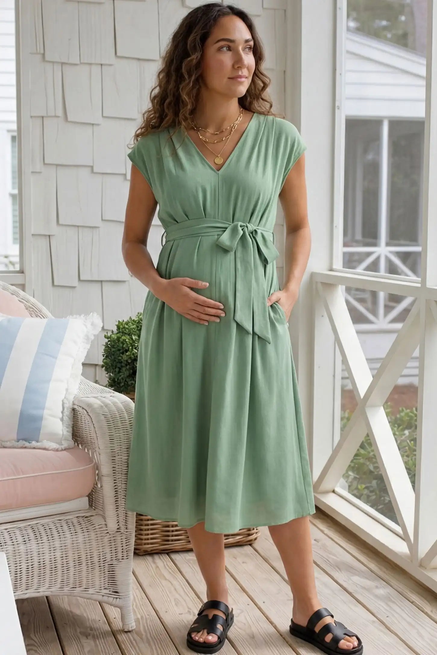 Cap Sleeves Belted Maternity Midi Dress Cap Sleeves Belted Maternity Midi Dress in mint green featuring a V-neckline, cap sleeves, and a self-tie waist belt on a pregnant model.