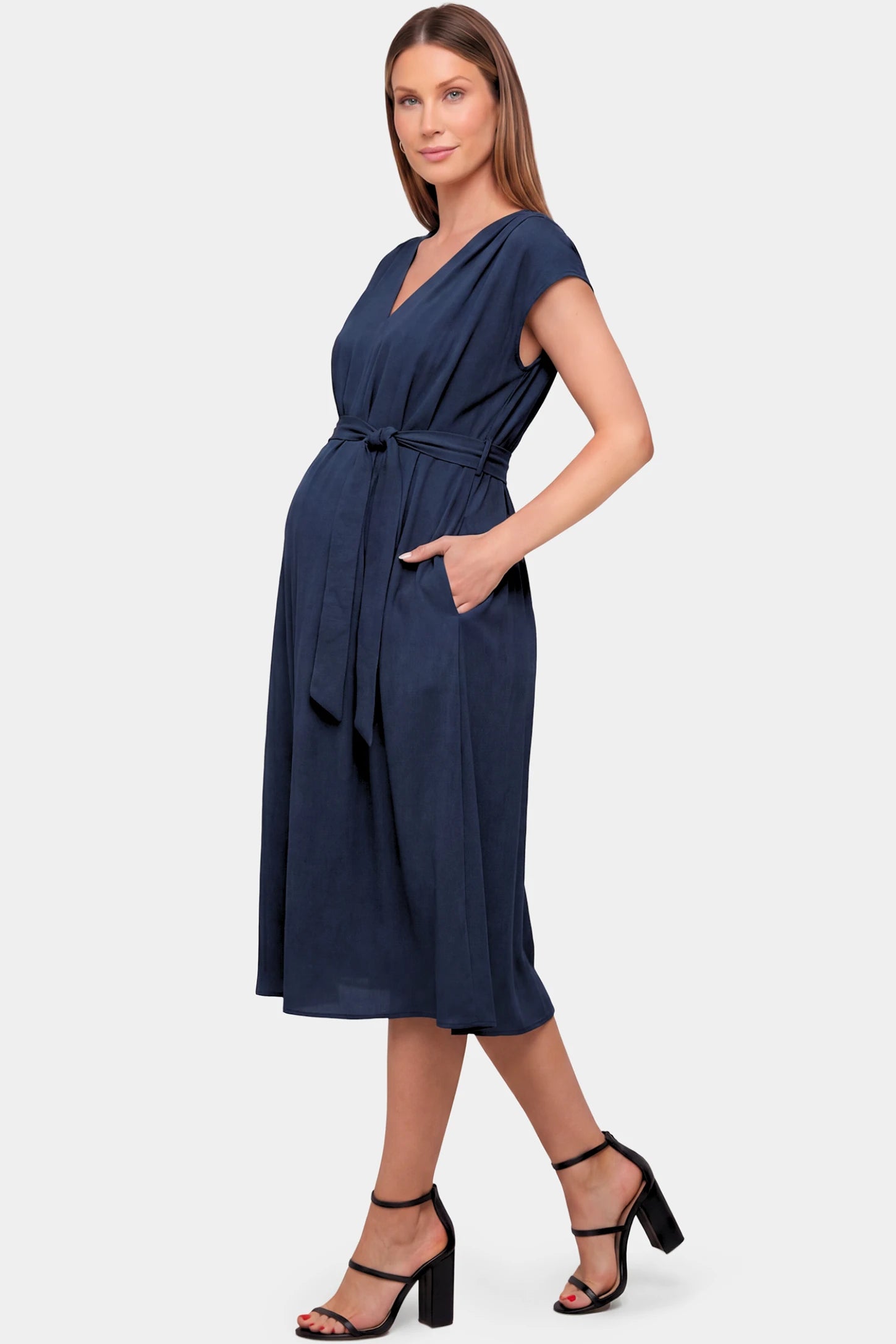 Cap Sleeves Belted Maternity Midi Dress Cap Sleeves Belted Maternity Midi Dress in navy blue featuring a V-neckline, cap sleeves, and a self-tie waist belt on a pregnant model.