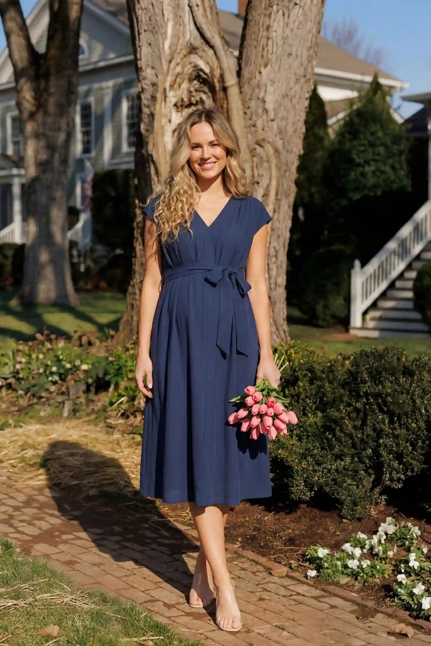 Cap Sleeves Belted Maternity Midi Dress Cap Sleeves Belted Maternity Midi Dress in navy blue featuring a V-neckline, cap sleeves, and a self-tie waist belt on a pregnant model.