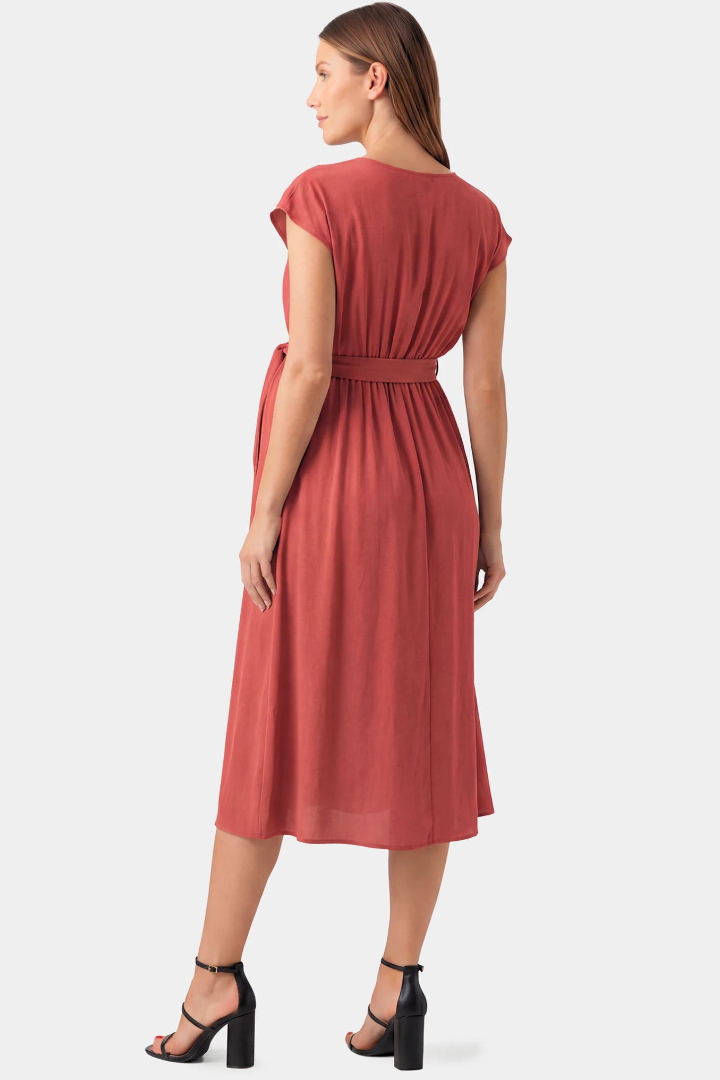Cap Sleeves Belted Maternity Midi Dress Cap Sleeves Belted Maternity Midi Dress in orange featuring cap sleeves, and a self-tie waist belt on a pregnant model.