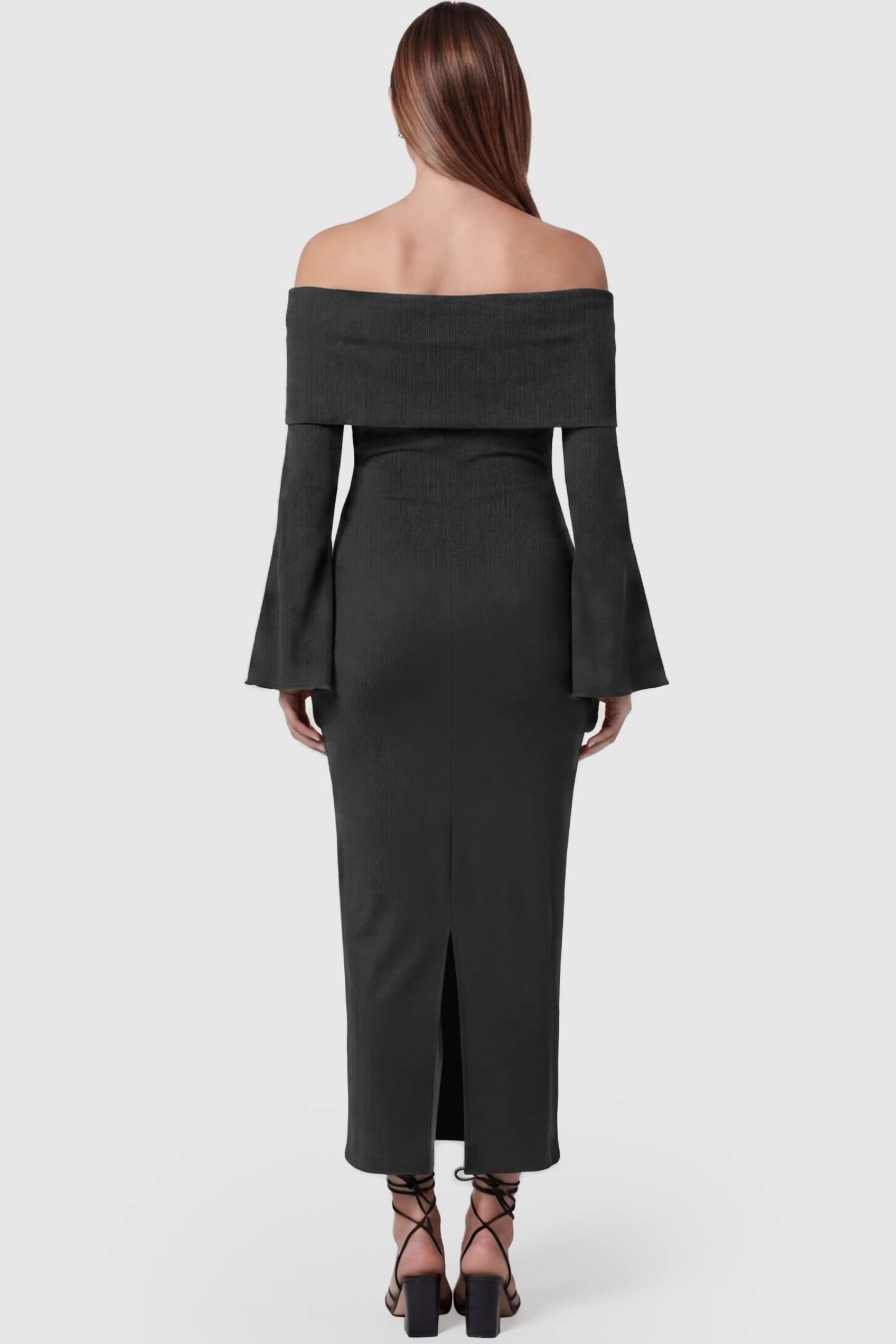 Ruched Off-shoulder Bodycon Maternity Midi Dress Ruched off-shoulder bodycon maternity midi dress in black with long sleeves and back slit, back view on pregnant model