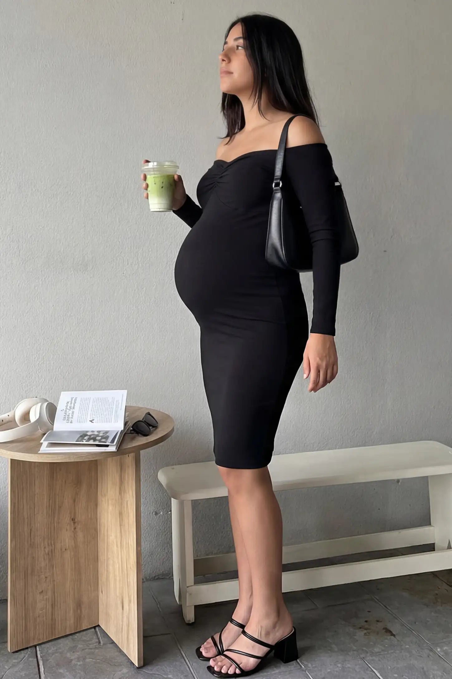 Off-Shoulder Bodycon Maternity Midi Dress Off-Shoulder Bodycon Maternity Midi Dress in black featuring sweetheart neckline and long sleeves on a pregnant model.