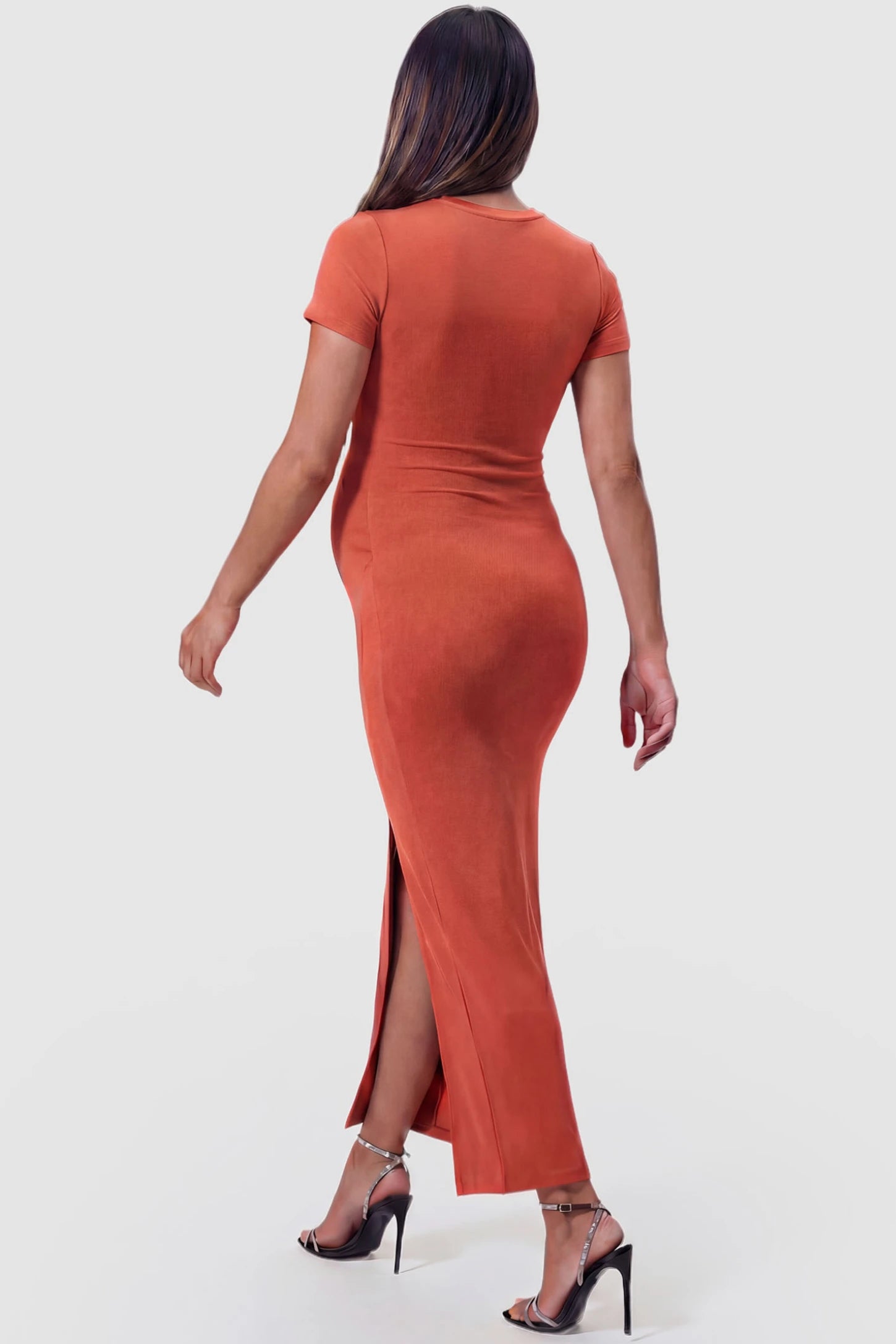 Short Sleeve Round Neck Bodycon Maxi Maternity Dress Short sleeve round neck bodycon maxi maternity dress in orange featuring figure-hugging knit fabric in back view on a pregnant model