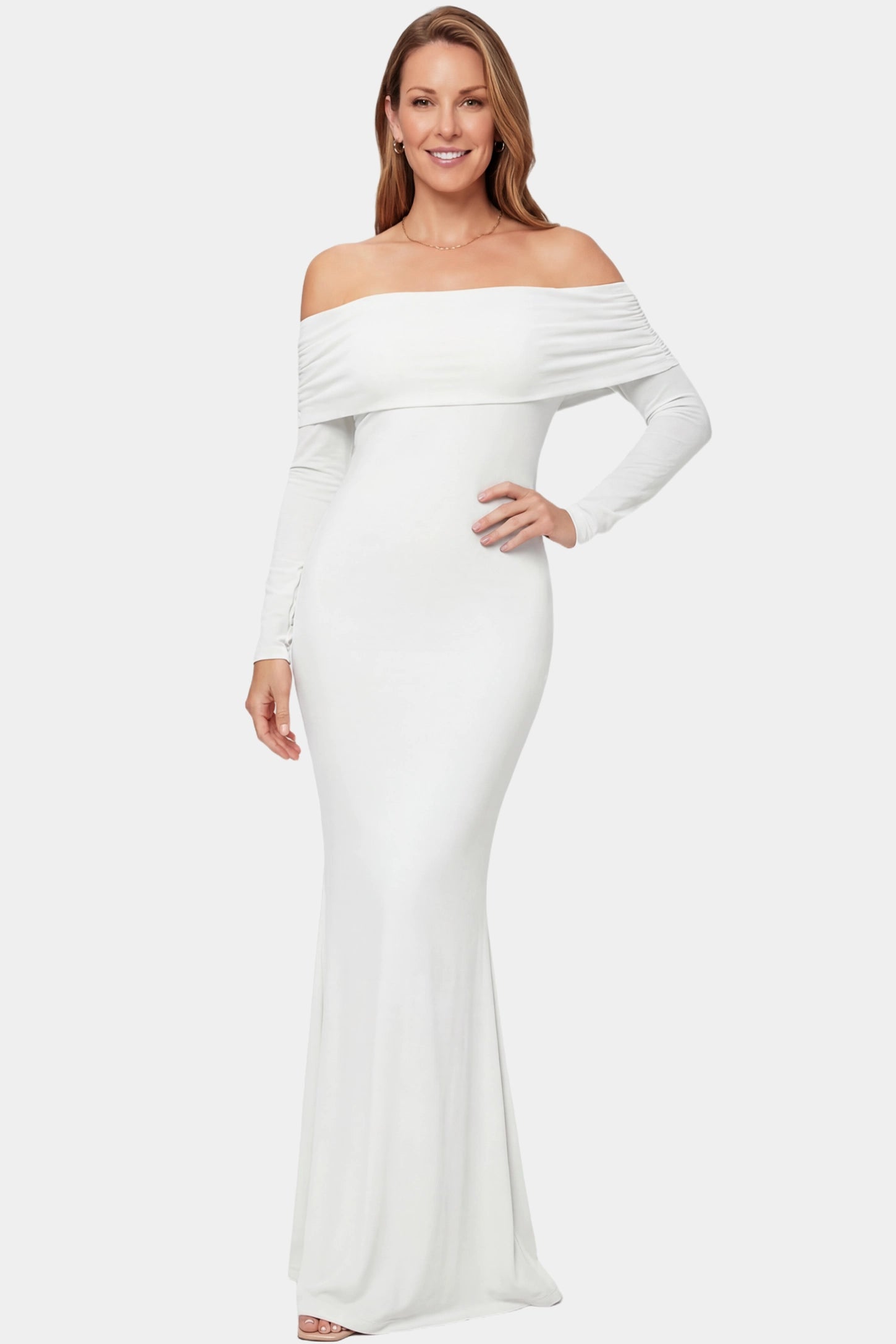 Off-the-Shoulder Long Sleeve Bodycon Maxi Maternity Dress Off-the-shoulder long sleeve bodycon maxi maternity dress in white featuring fitted silhouette in full body front view on a postpartum model