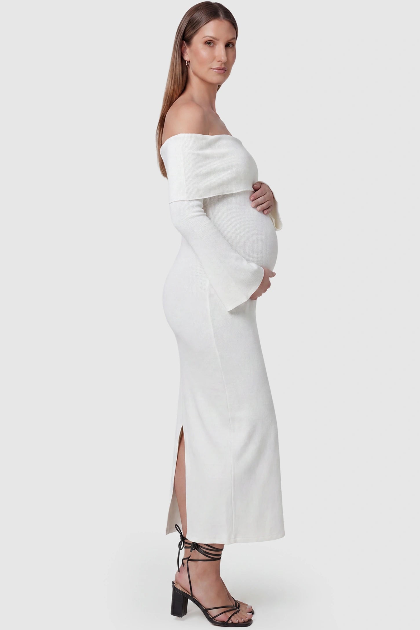 Ruched Off-shoulder Bodycon Maternity Midi Dress Ruched off-shoulder bodycon maternity midi dress in white with ruched side detailing, side view on pregnant model
