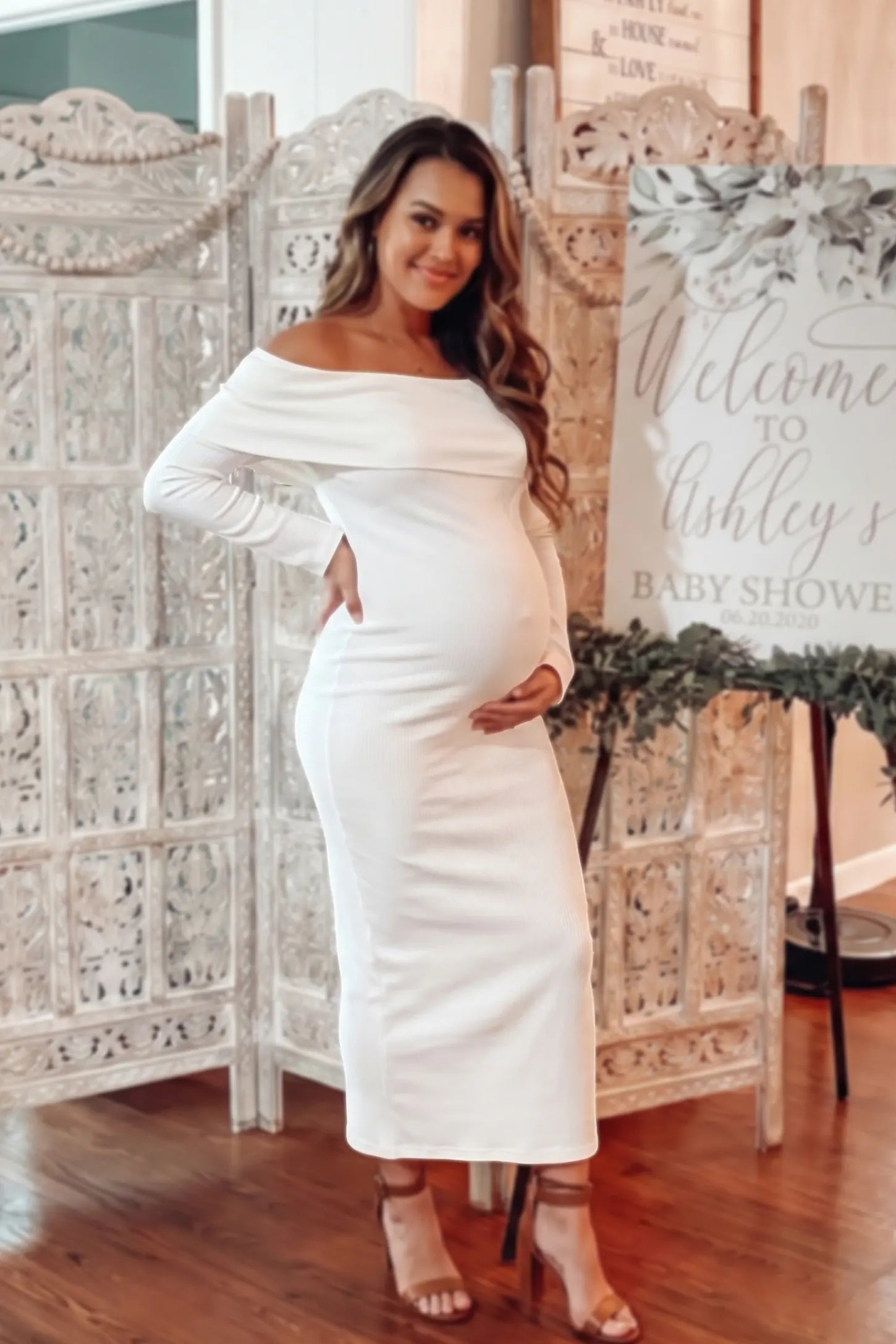 Ruched Off-shoulder Bodycon Maternity Midi Dress Ruched off-shoulder bodycon maternity midi dress in white with off-shoulder neckline, front view on pregnant model