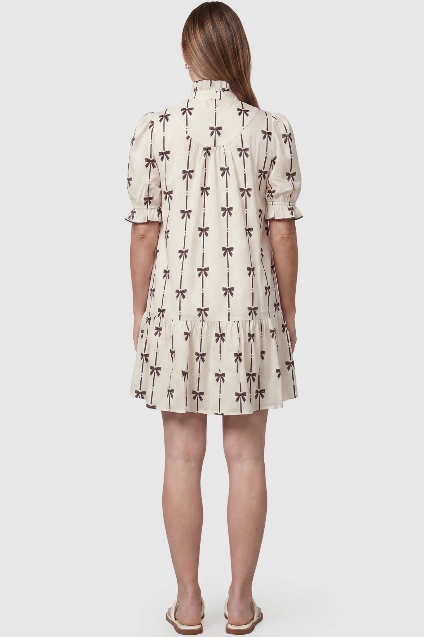 Bowknot Print Button-Up Neck Maternity Short Dress Bowknot print button-up neck maternity short dress in beige with bowknot print detail, back view on pregnant model