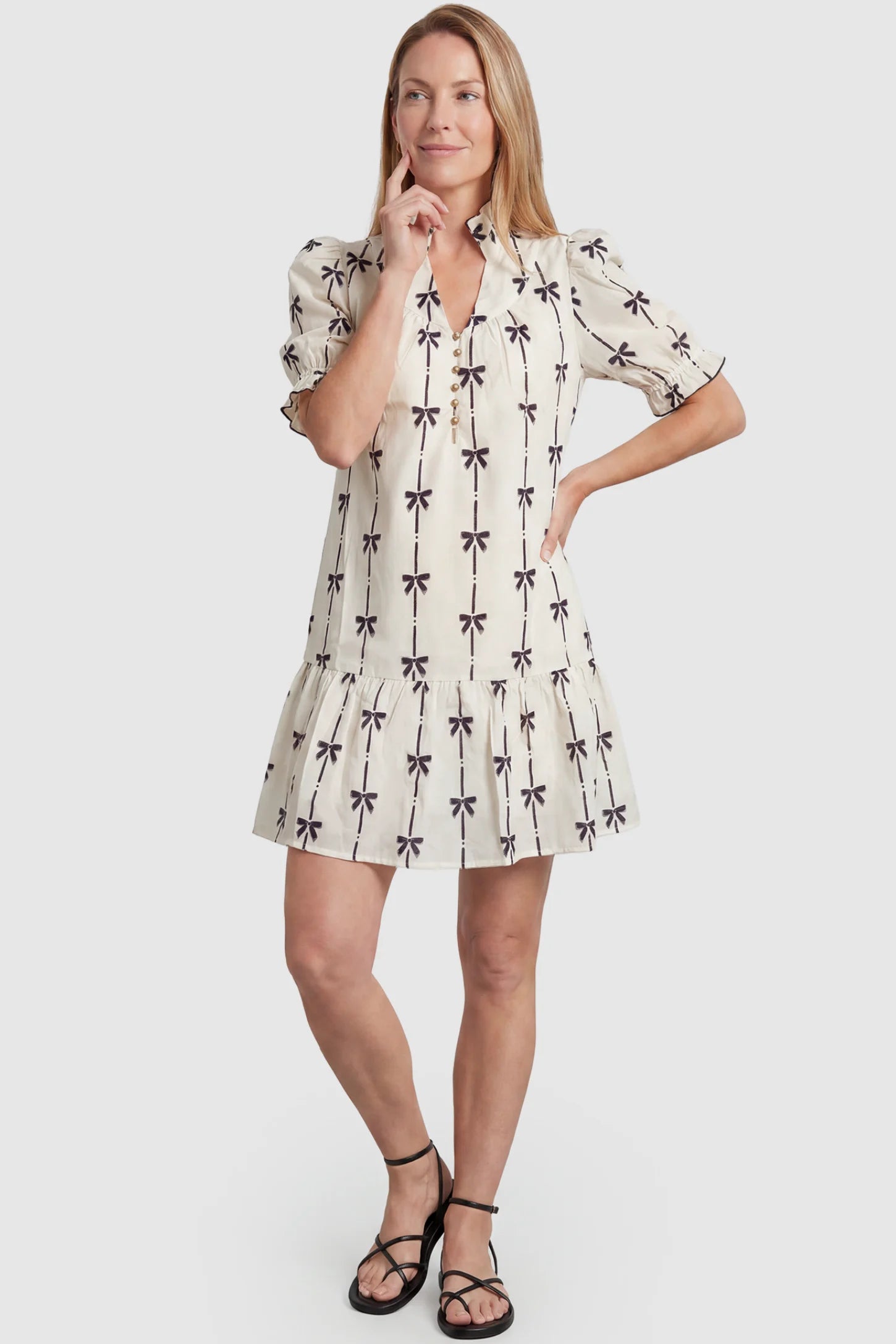 Bowknot Print Button-Up Neck Maternity Short Dress Bowknot print button-up neck maternity short dress in beige with bowknot print detail, front view on postpartum model
