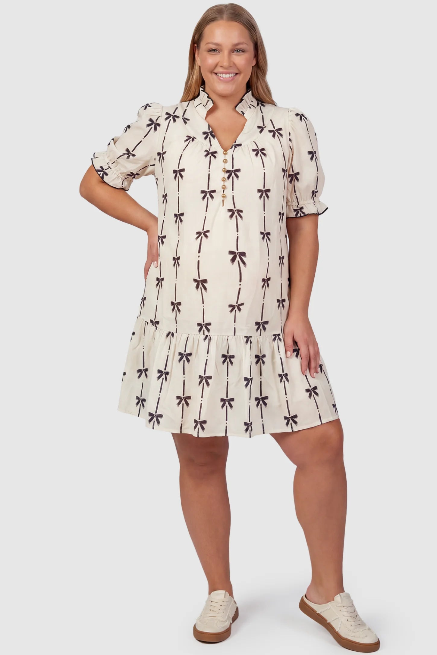Bowknot Print Button-Up Neck Maternity Short Dress Bowknot print button-up neck maternity short dress in beige with bowknot print detail, front view on plus-size model