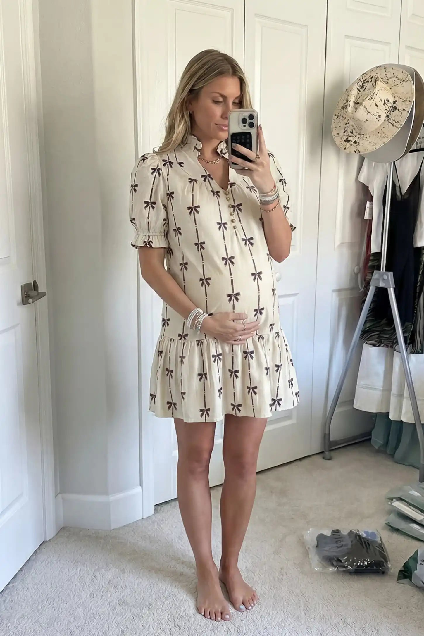 Bowknot Print Button-Up Neck Maternity Short Dress Bowknot print button-up neck maternity short dress in beige with bowknot print detail, front view on pregnant model
