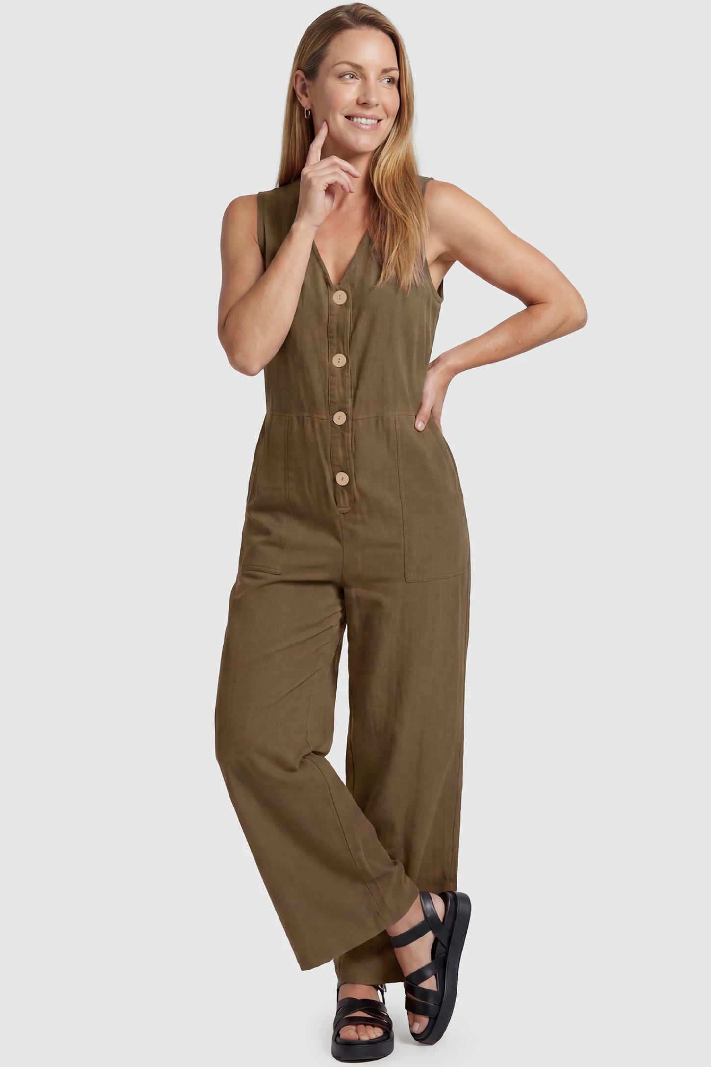 Wide-Leg V-Neck Button-Front Maternity Jumpsuit Wide-leg V-neck button-front maternity jumpsuit in brown with sleeveless V-neckline and button-front detail, front view on postpartum model