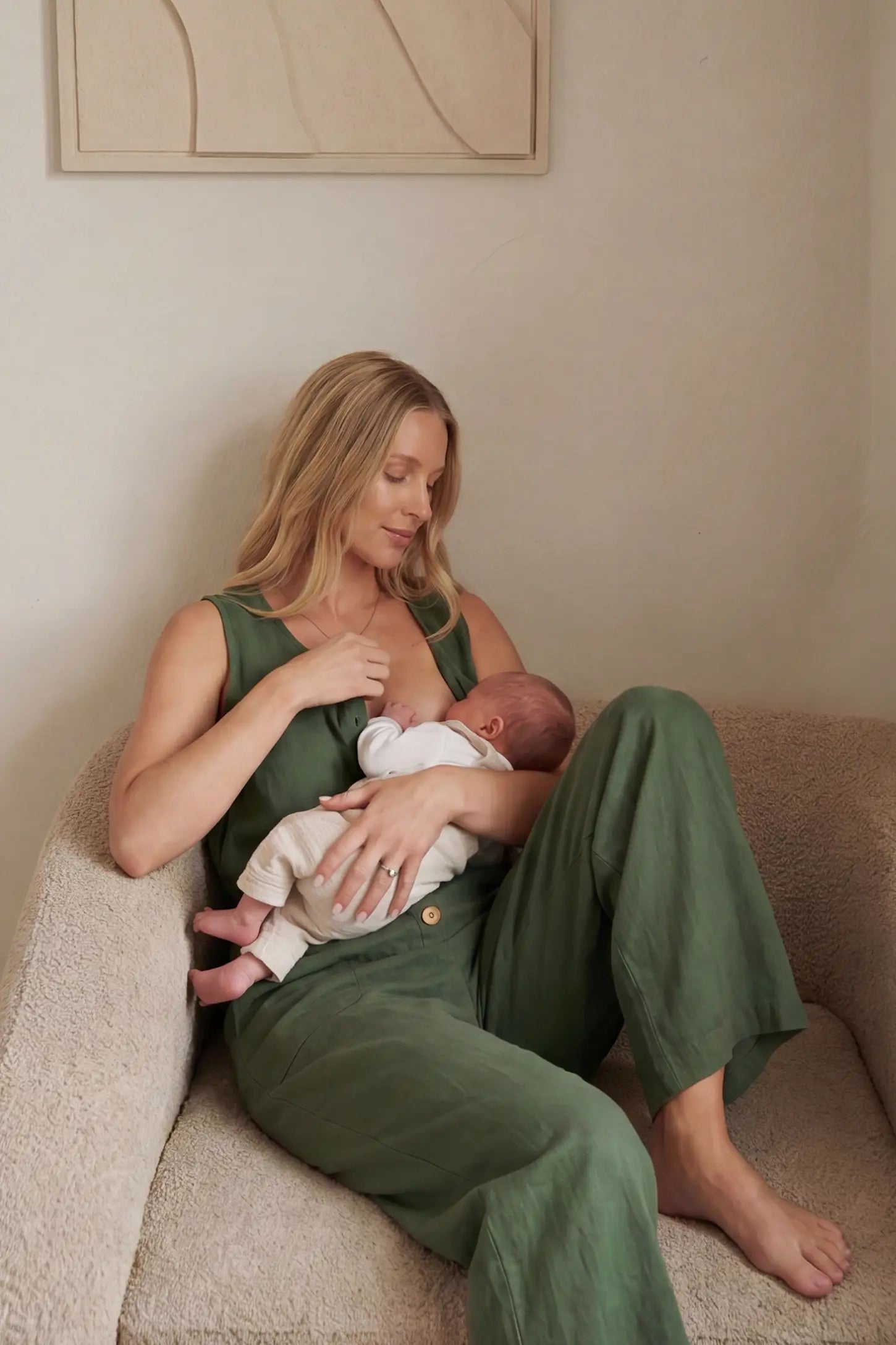 Wide-Leg V-Neck Button-Front Maternity Jumpsuit Wide-leg V-neck button-front maternity jumpsuit in green with discreet nursing access, front view on pregnant model