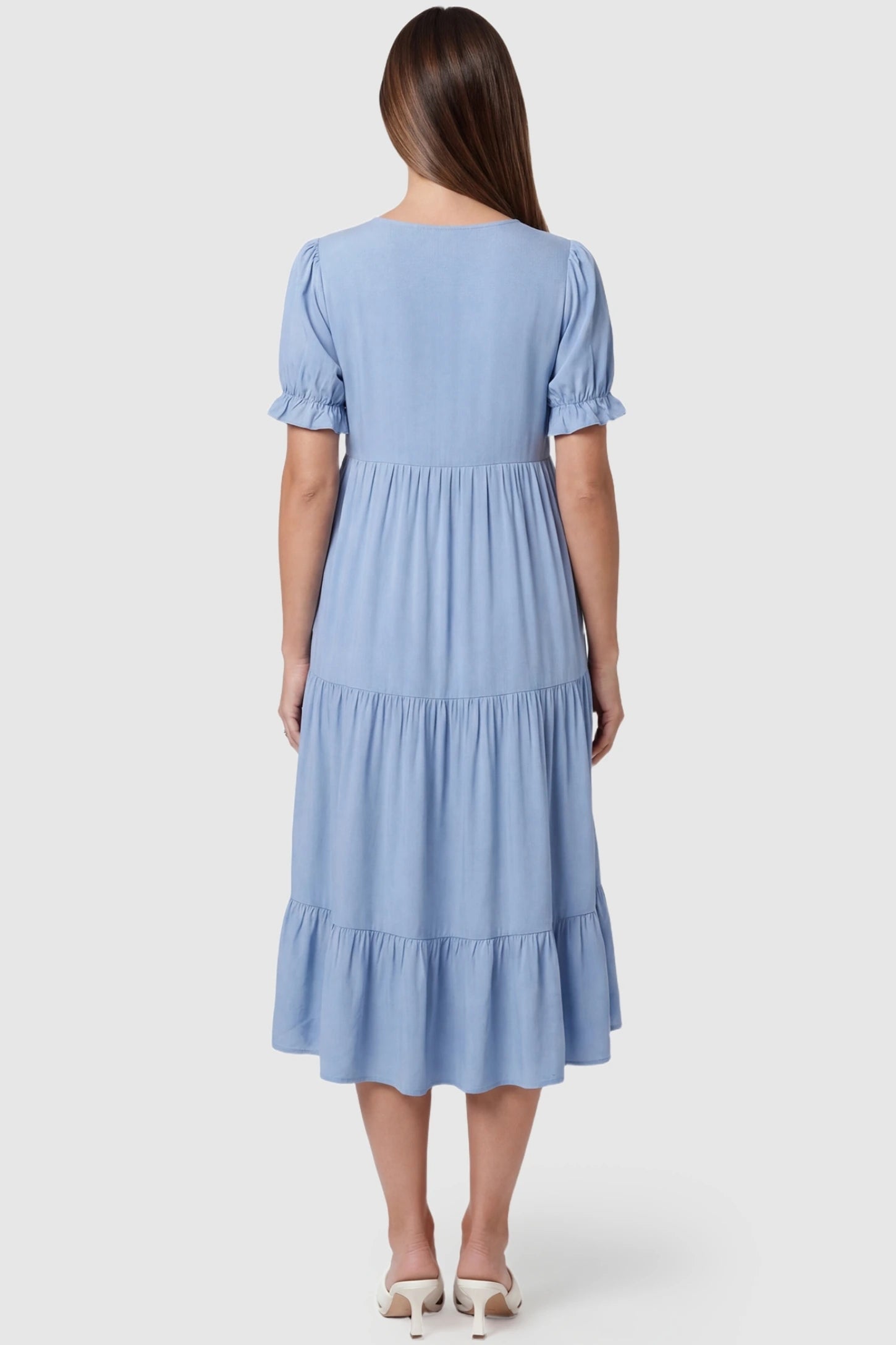 Button-Front Tiered Maternity Midi Dress Button-Front Tiered Maternity Midi Dress in Blue featuring a tiered skirt and midi-length hem on a pregnant model.
