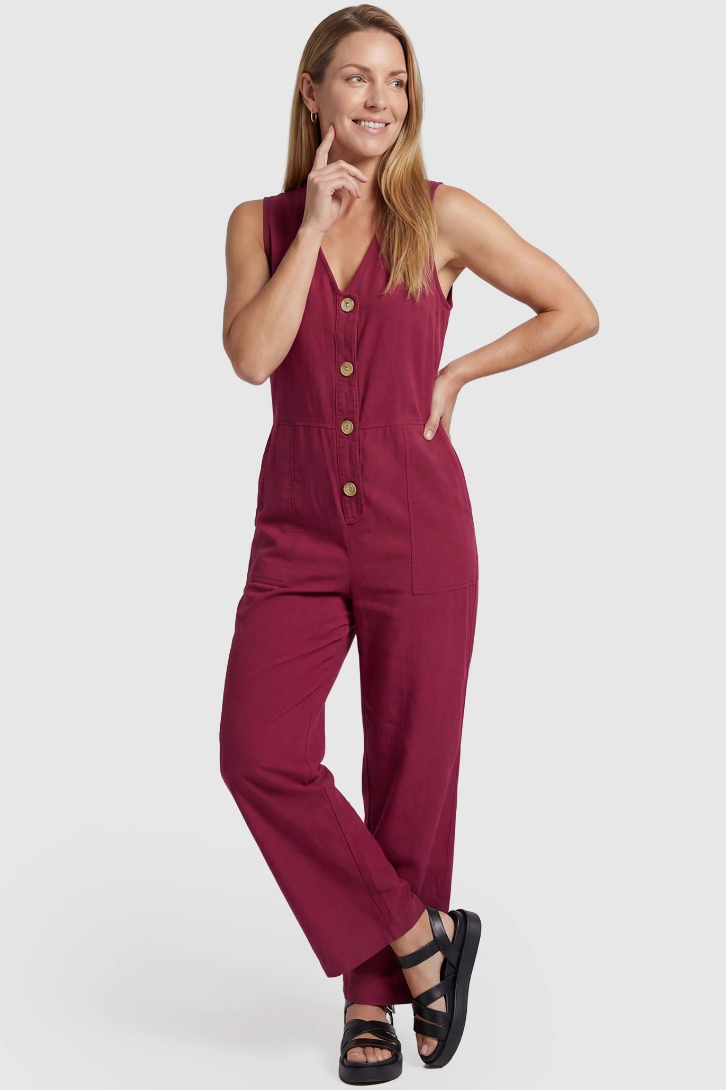 Wide-Leg V-Neck Button-Front Maternity Jumpsuit Wide-leg V-neck button-front maternity jumpsuit in wine red with sleeveless V-neckline and button-front detail, front view on postpartum model