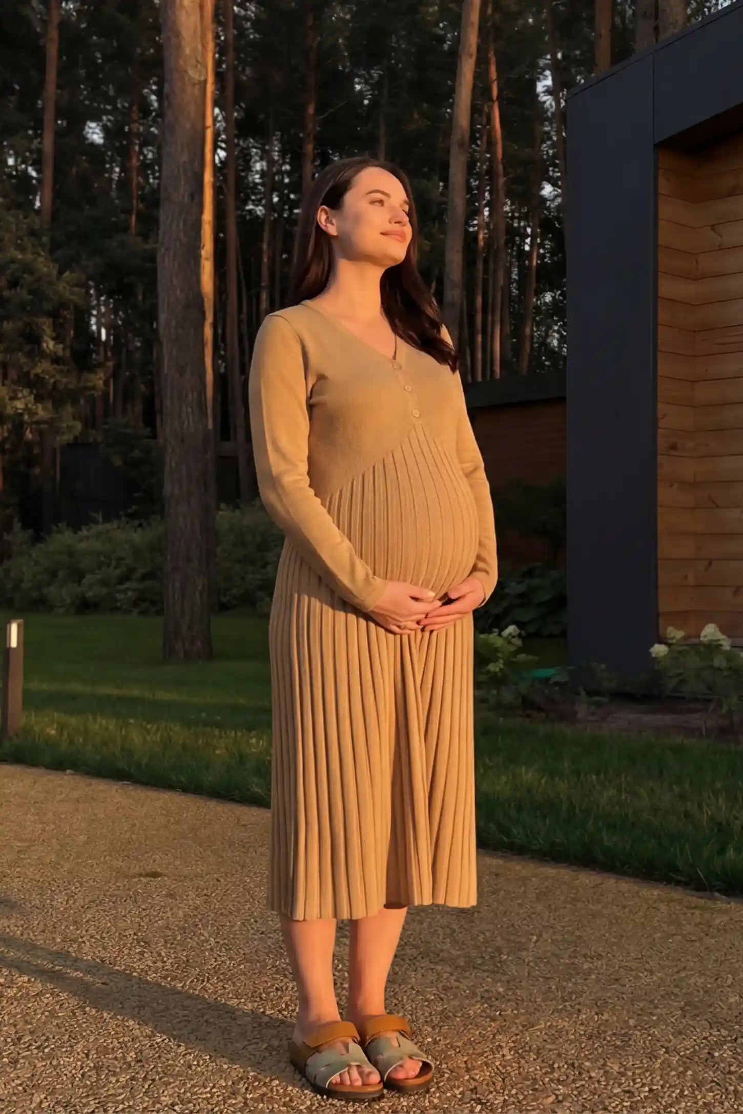 Button-Up Empire Waist Maternity Midi Dress Button-up empire waist maternity midi dress in beige with button-up front detail, front view on pregnant model