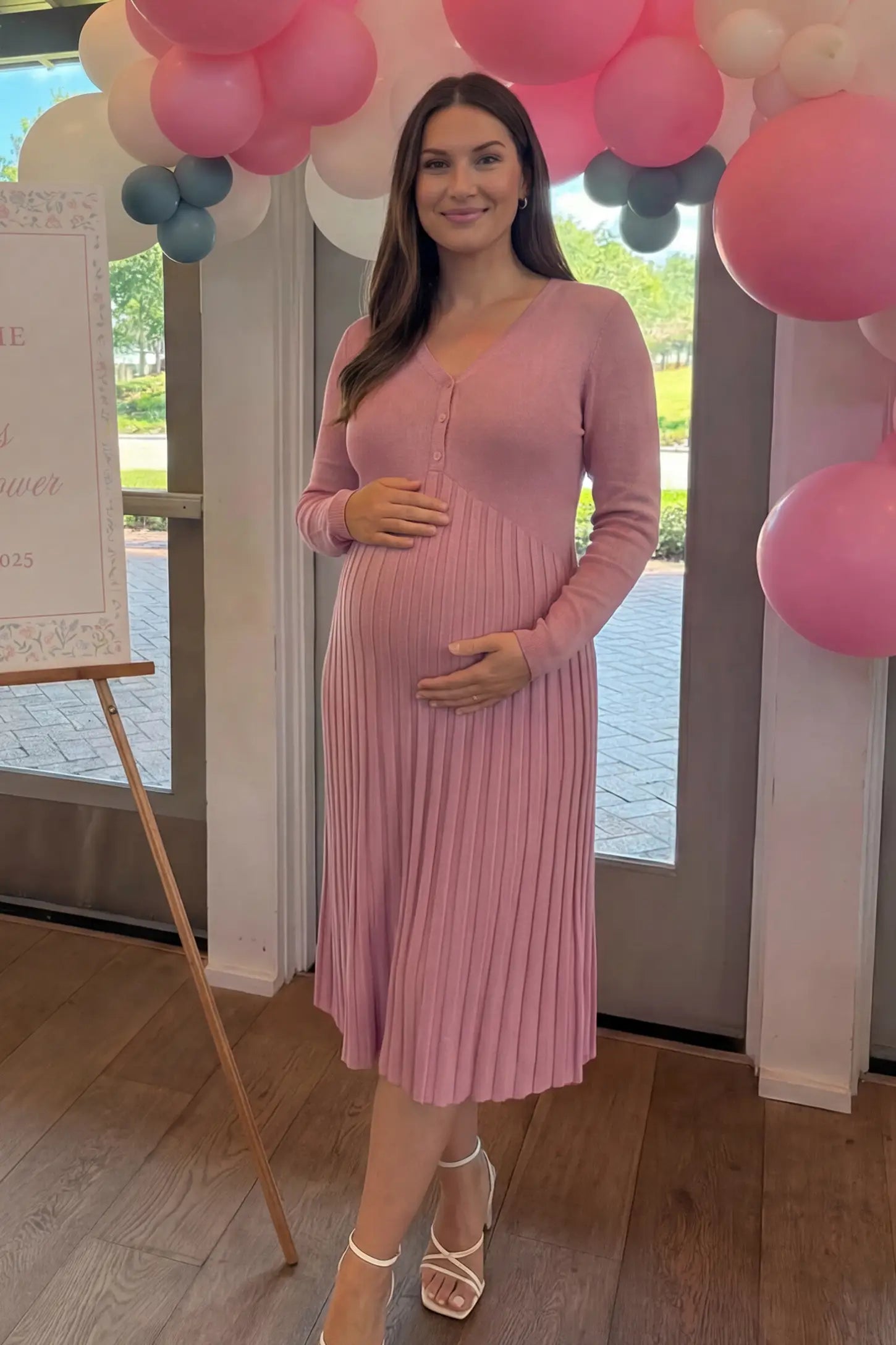 Button-Up Empire Waist Maternity Midi Dress Button-up empire waist maternity midi dress in black with button-up front detail, front view on pregnant model