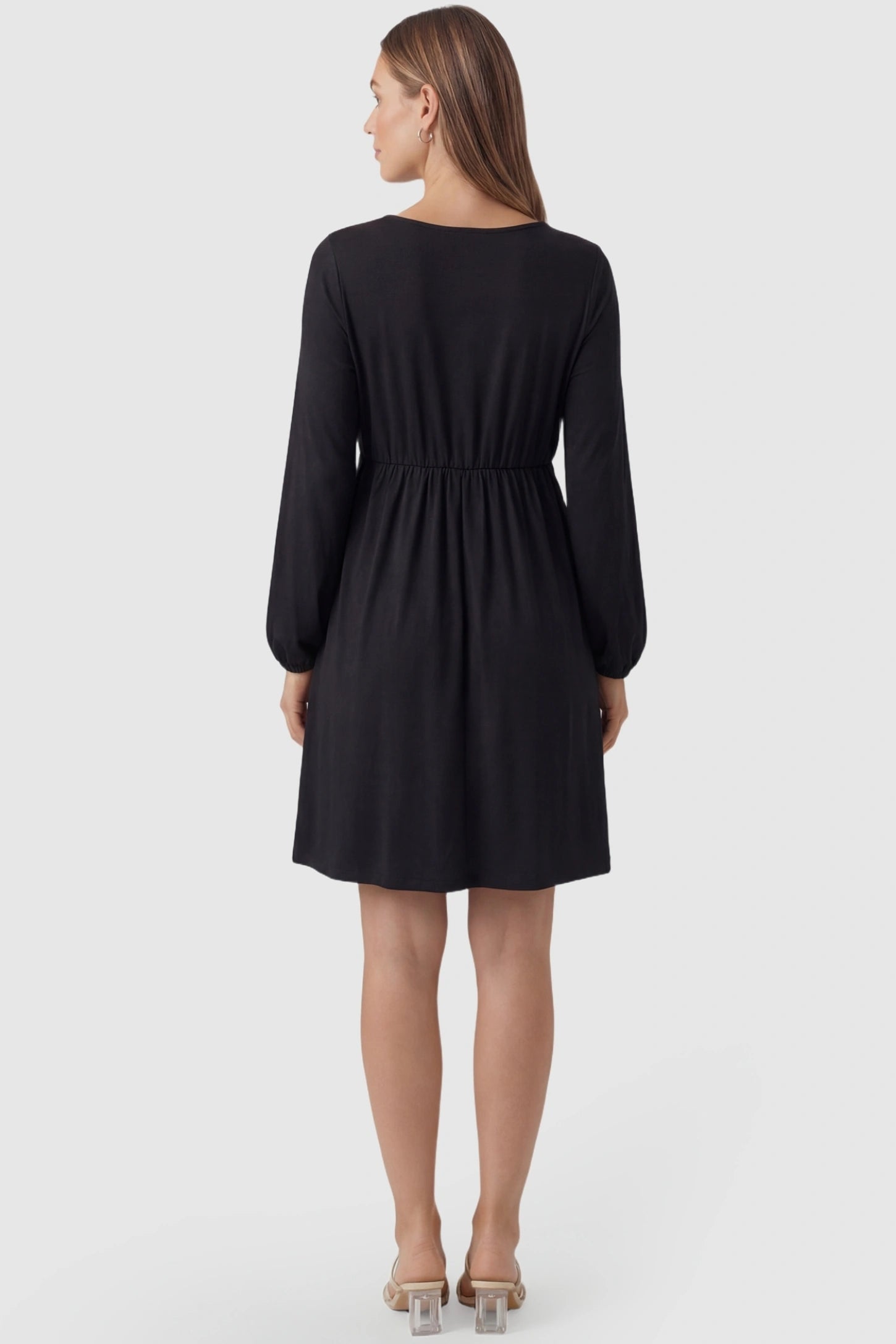 Button-Front Drawstring Waist Maternity Mini Dress Button-Front Drawstring Waist Maternity Mini Dress in Black featuring a high-waisted round neck design on a pregnant model, back view.