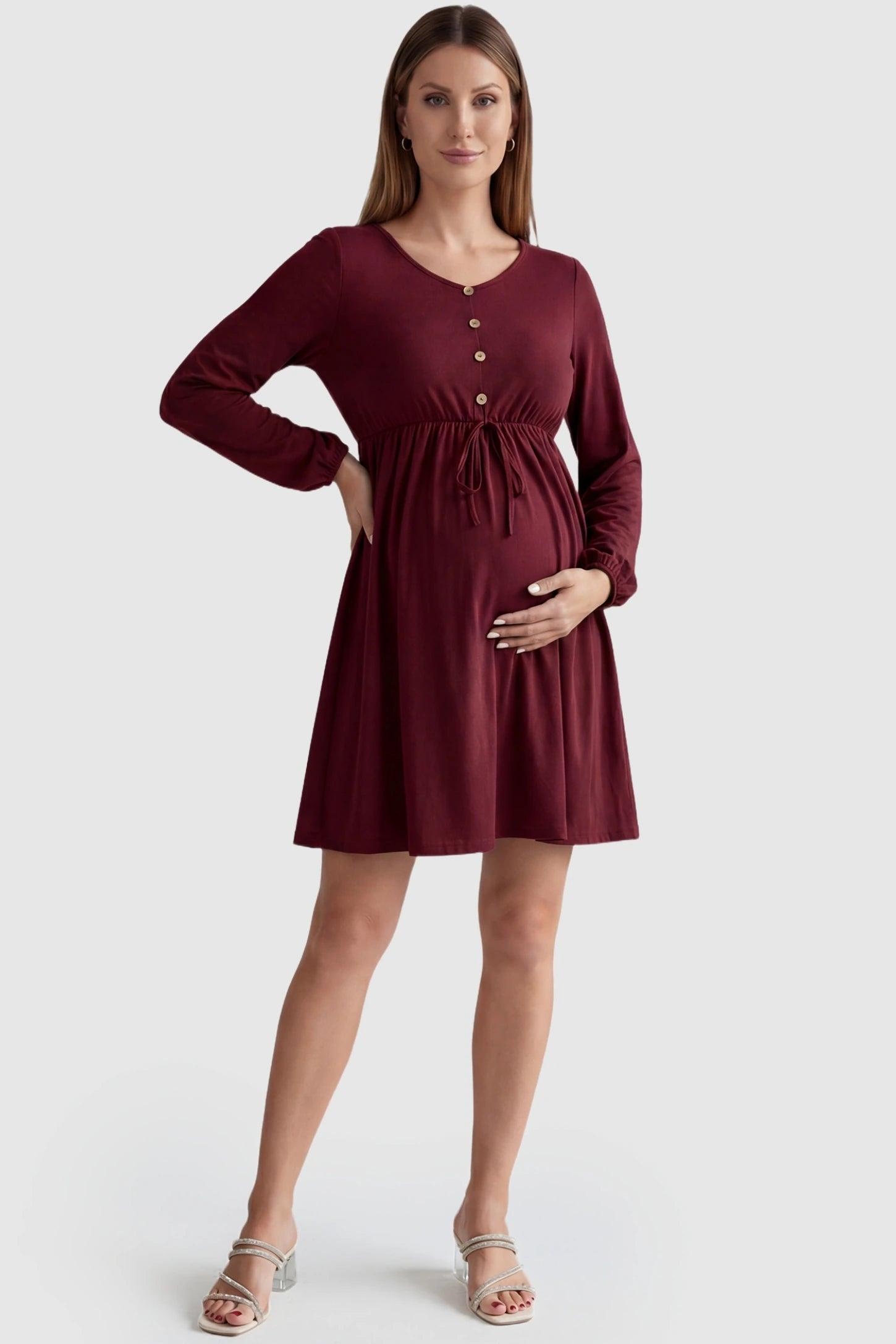 Button-Front Drawstring Waist Maternity Mini Dress in Wine Red featuring a gathered waist on a pregnant model, front view.