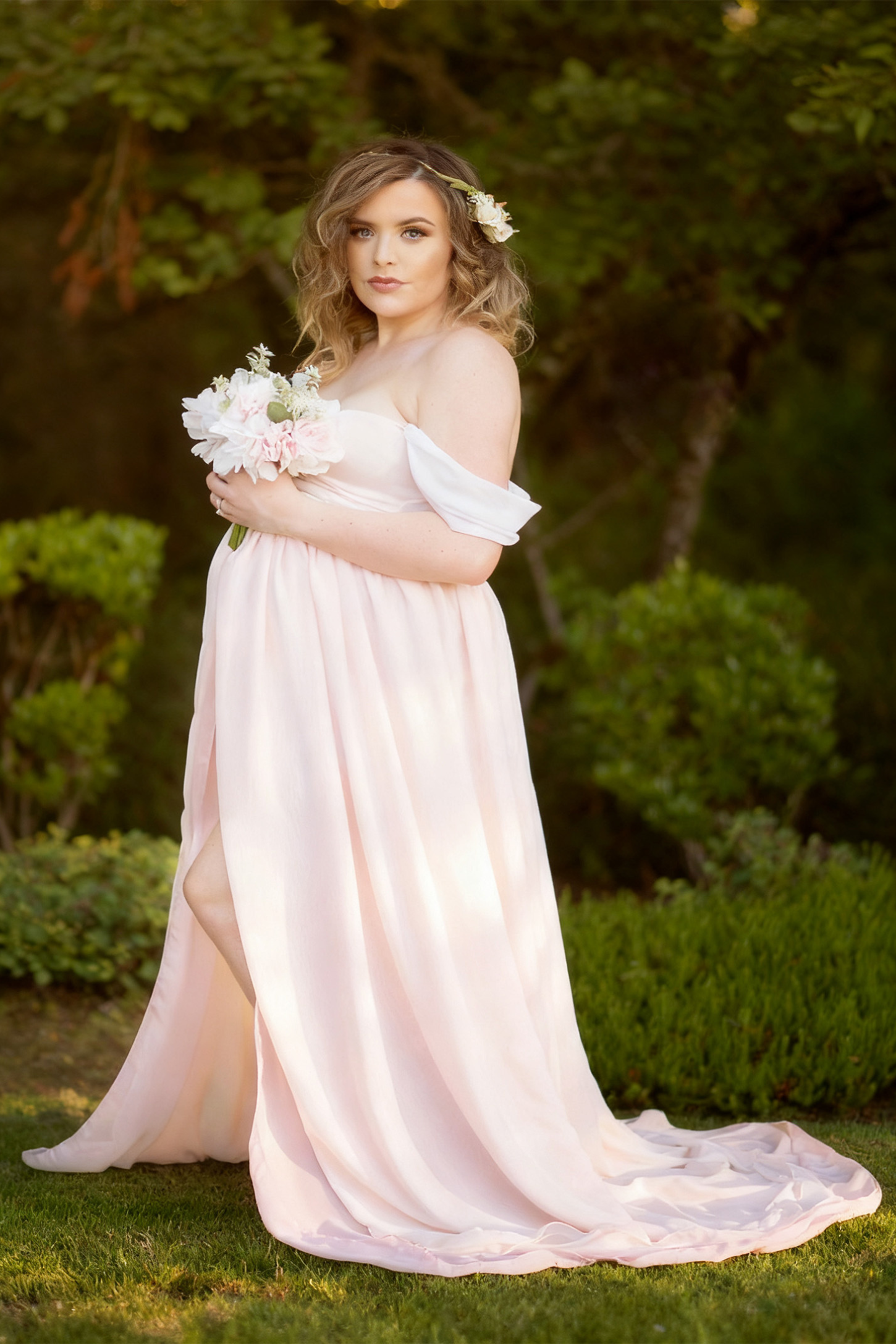Cap Sleeve Empire Waist Maternity Photoshoot Gown in pink featuring sweetheart neckline and flowy skirt on pregnant model.