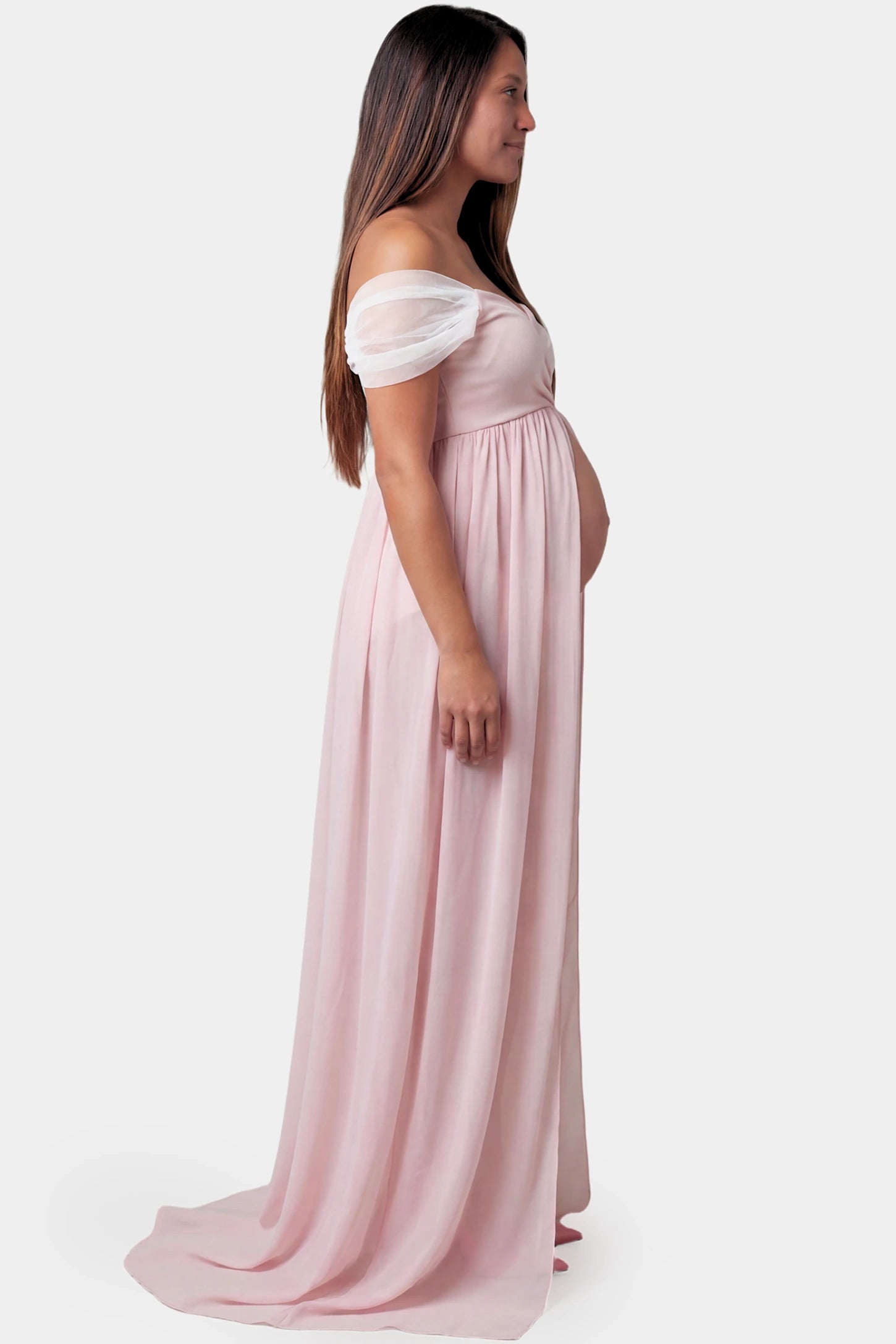 Cap Sleeve Empire Waist Maternity Photoshoot Gown Cap Sleeve Empire Waist Maternity Photoshoot Gown in pink featuring sweetheart neckline and flowy skirt on pregnant model.