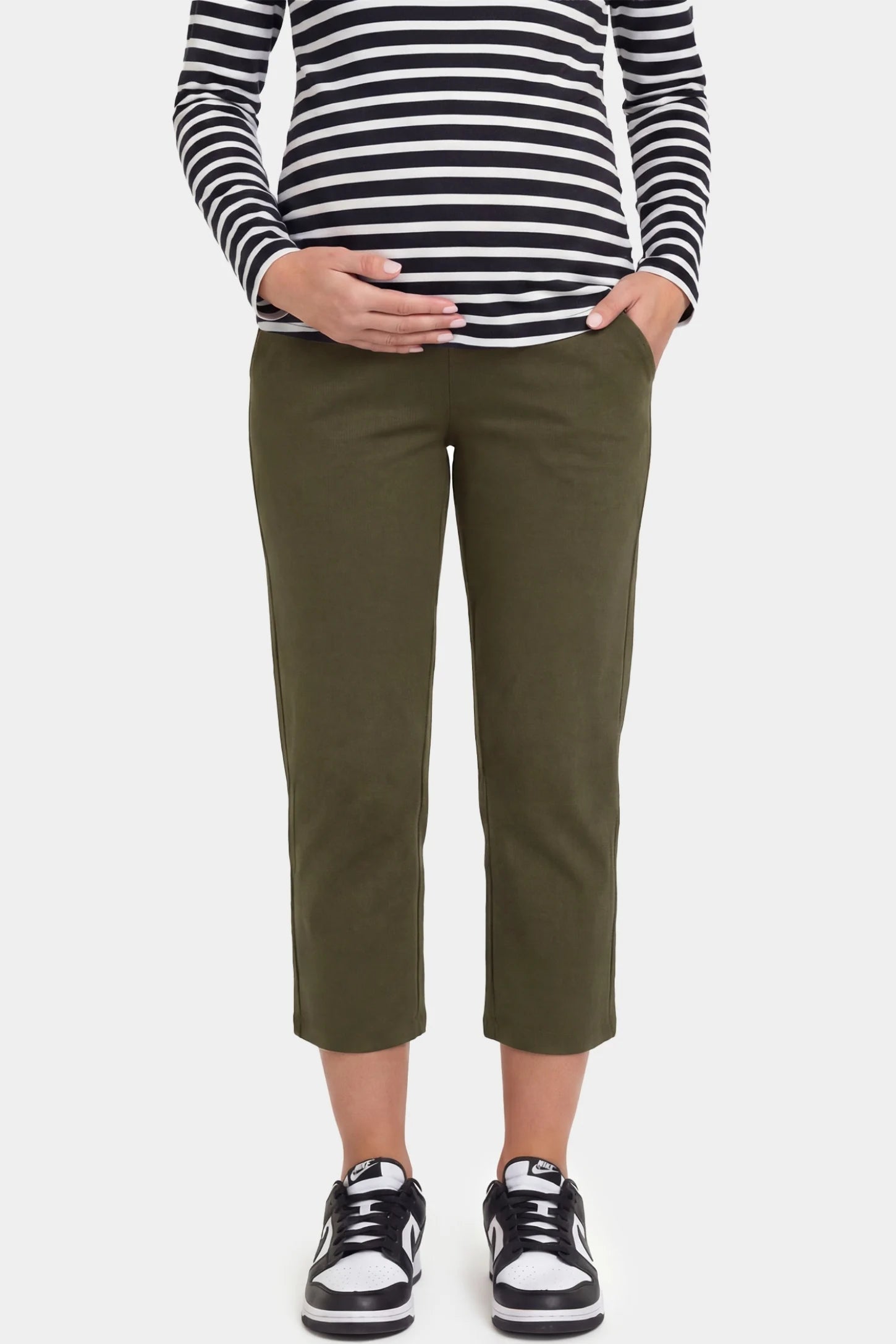 High-Waist Belly Support Loose-Fit Capri Maternity Pants High-waist belly support loose-fit capri maternity pants in army green with functional side pockets, front view on pregnant model