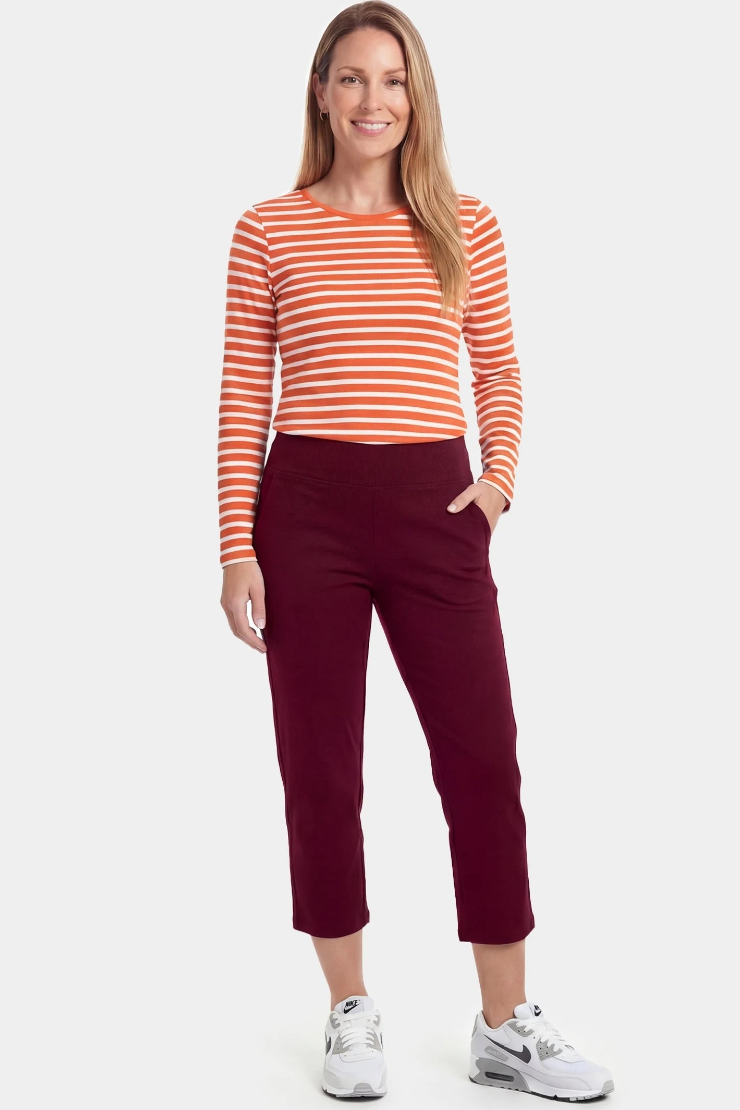 High-Waist Belly Support Loose-Fit Capri Maternity Pants High-waist belly support loose-fit capri maternity pants in burgundy with functional side pockets, full body on postpartum model