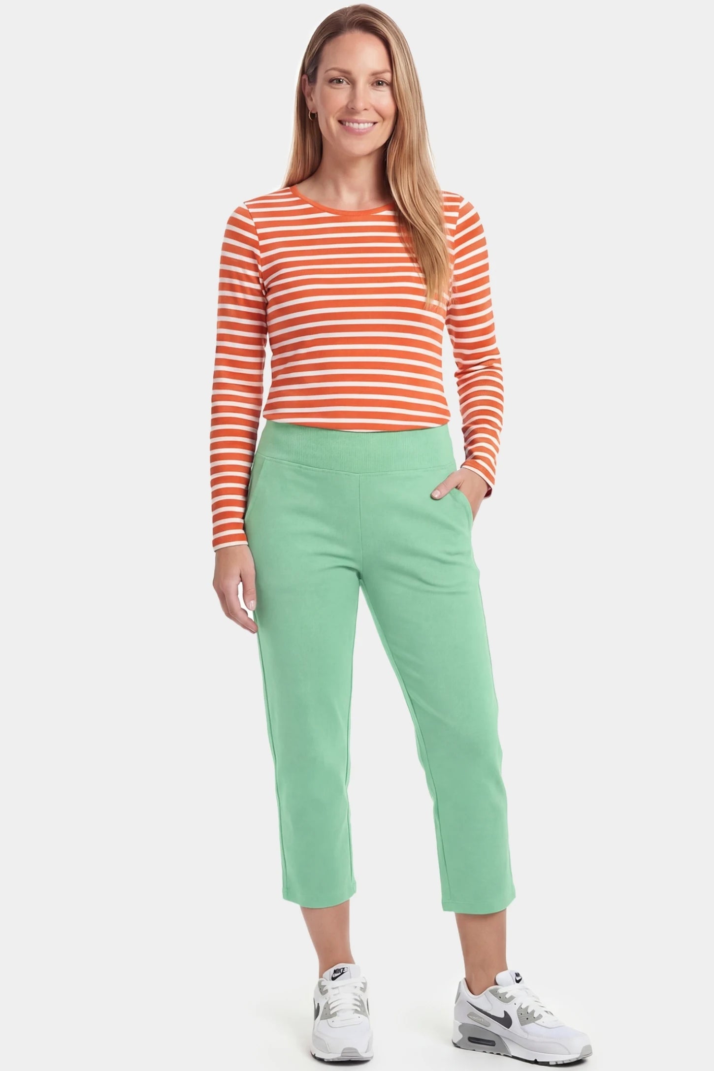 High-Waist Belly Support Loose-Fit Capri Maternity Pants High-waist belly support loose-fit capri maternity pants in emerald green with functional side pockets, full body on postpartum model