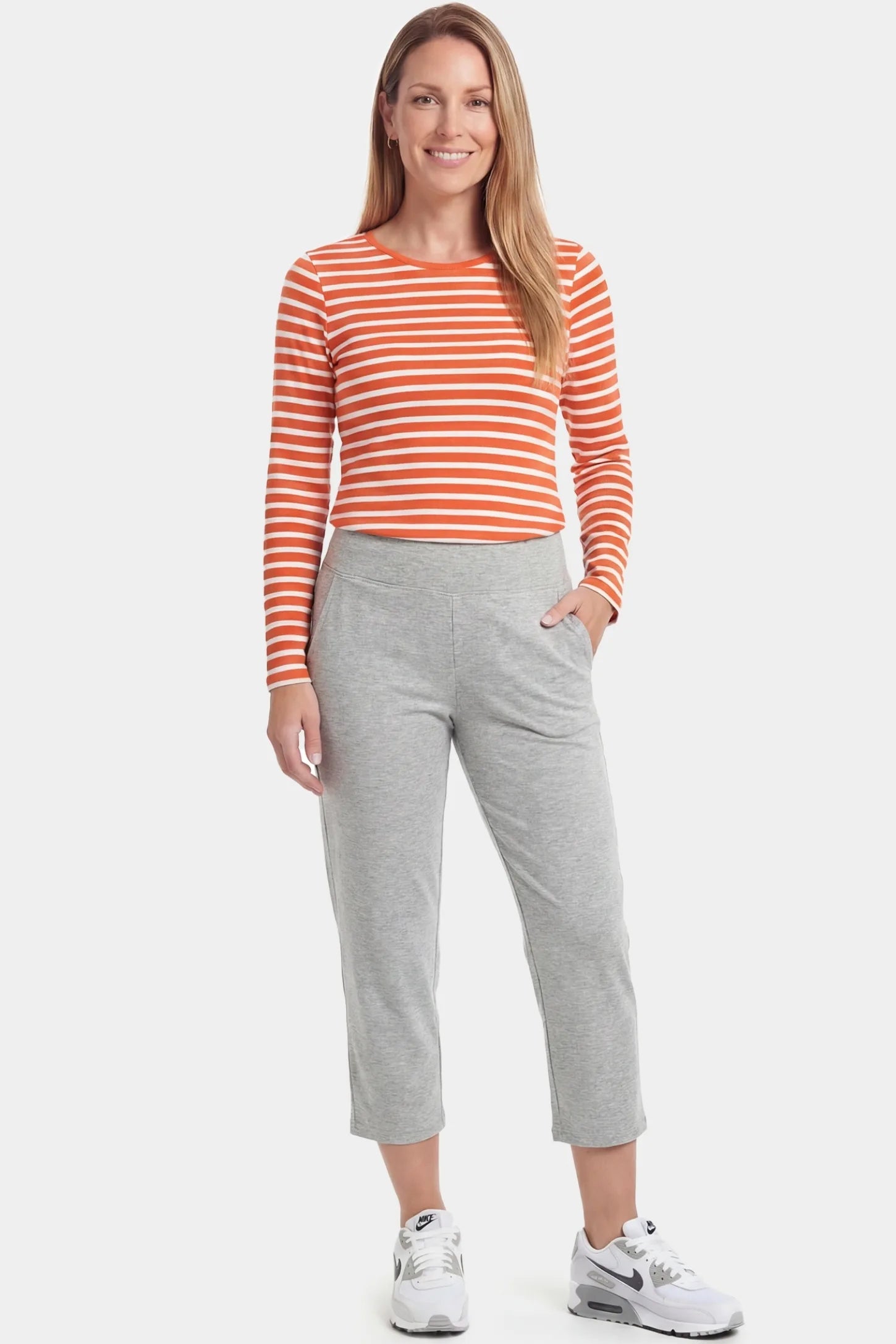 High-Waist Belly Support Loose-Fit Capri Maternity Pants High-waist belly support loose-fit capri maternity pants in light gray with functional side pockets, full body on postpartum model