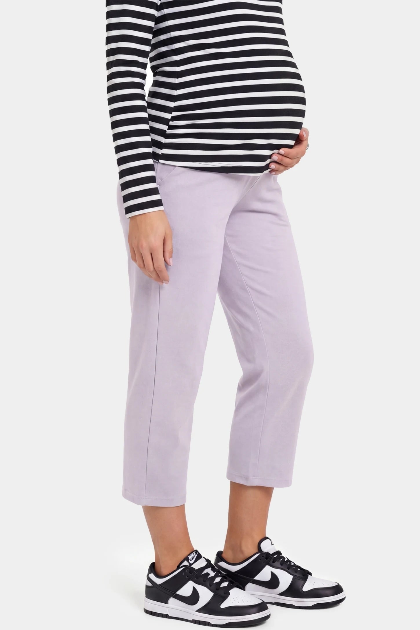 High-Waist Belly Support Loose-Fit Capri Maternity Pants High-waist belly support loose-fit capri maternity pants in light purple with cropped length, side view on pregnant model