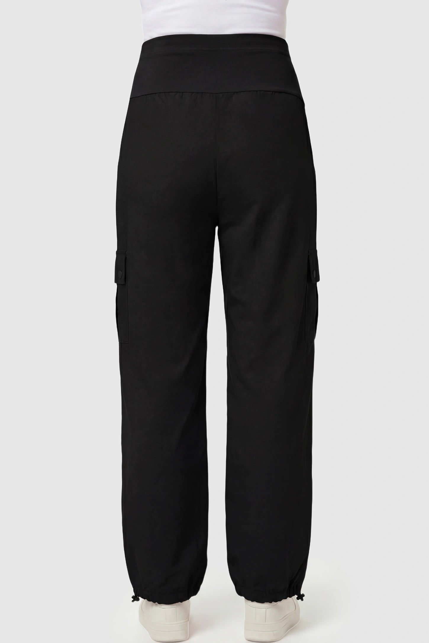 Ice Silk Cargo Maternity Pants Ice Silk Cargo Maternity Pants in black featuring full belly panel, cargo pockets, and relaxed full-length fit on pregnant model back view.