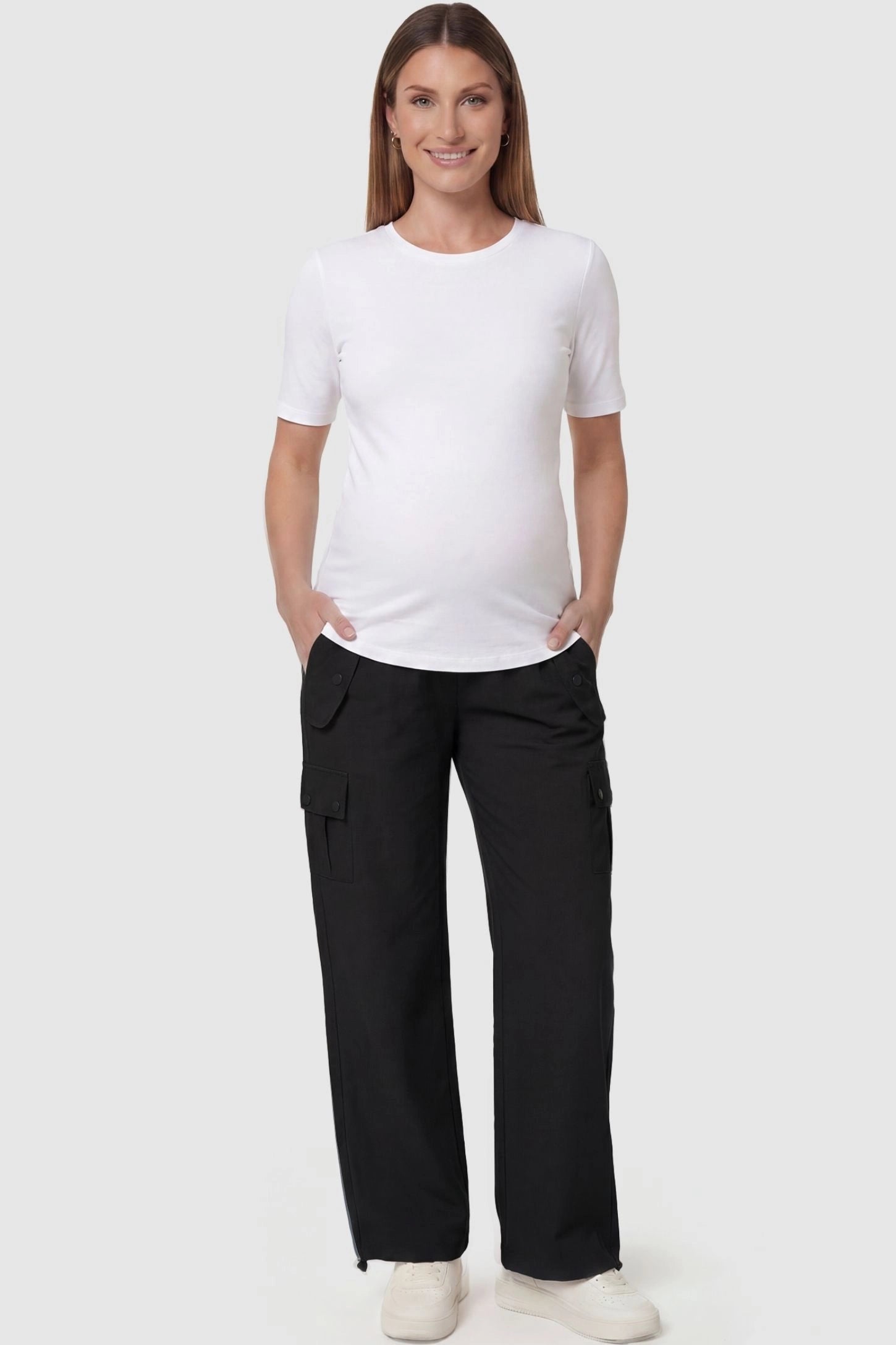 Ice Silk Cargo Maternity Pants Ice Silk Cargo Maternity Pants in black featuring full belly panel, cargo pockets, and relaxed full-length fit on pregnant model front view.