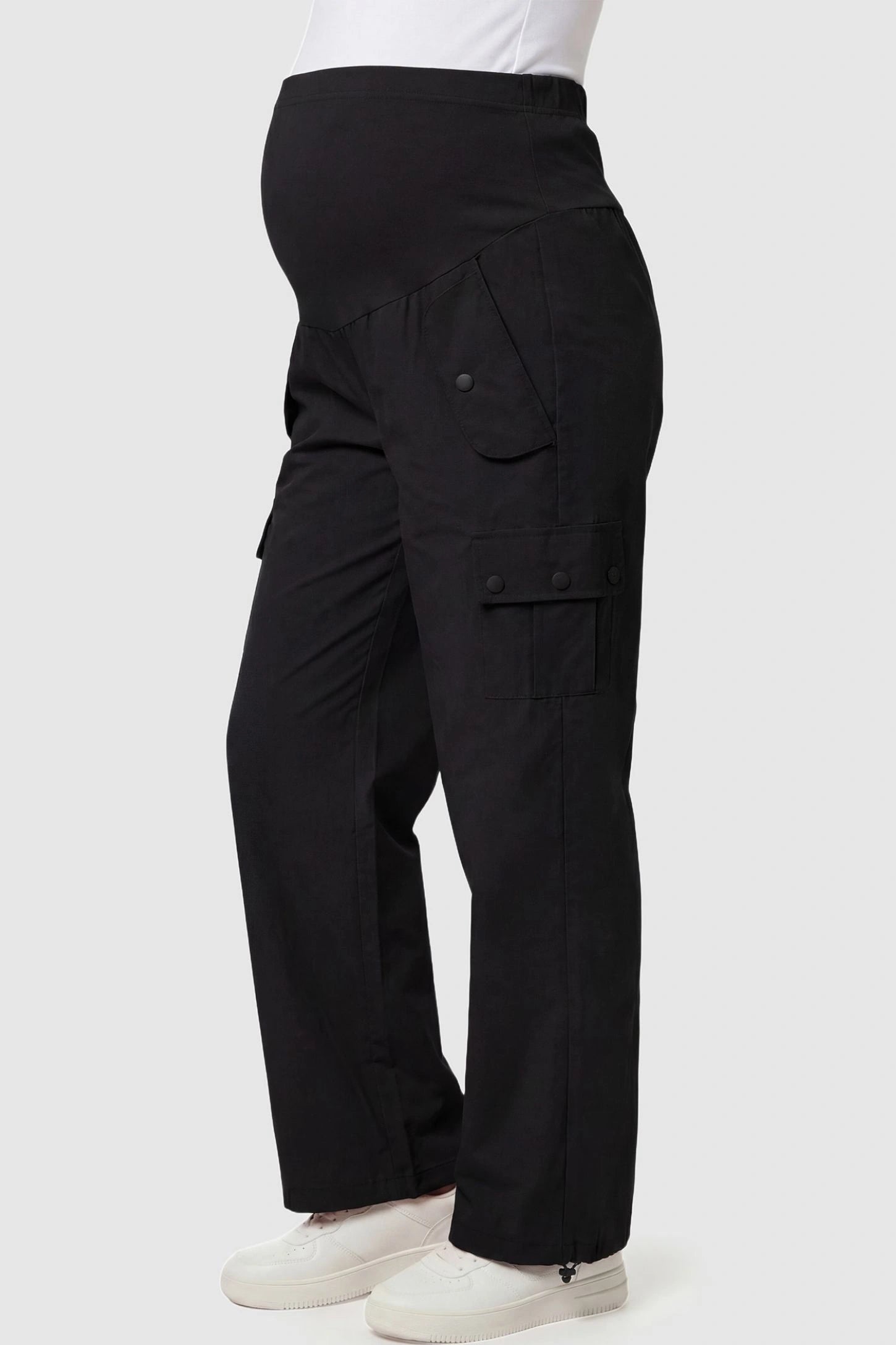 Ice Silk Cargo Maternity Pants Ice Silk Cargo Maternity Pants in black featuring full belly panel, cargo pockets, and relaxed full-length fit on pregnant model side view.