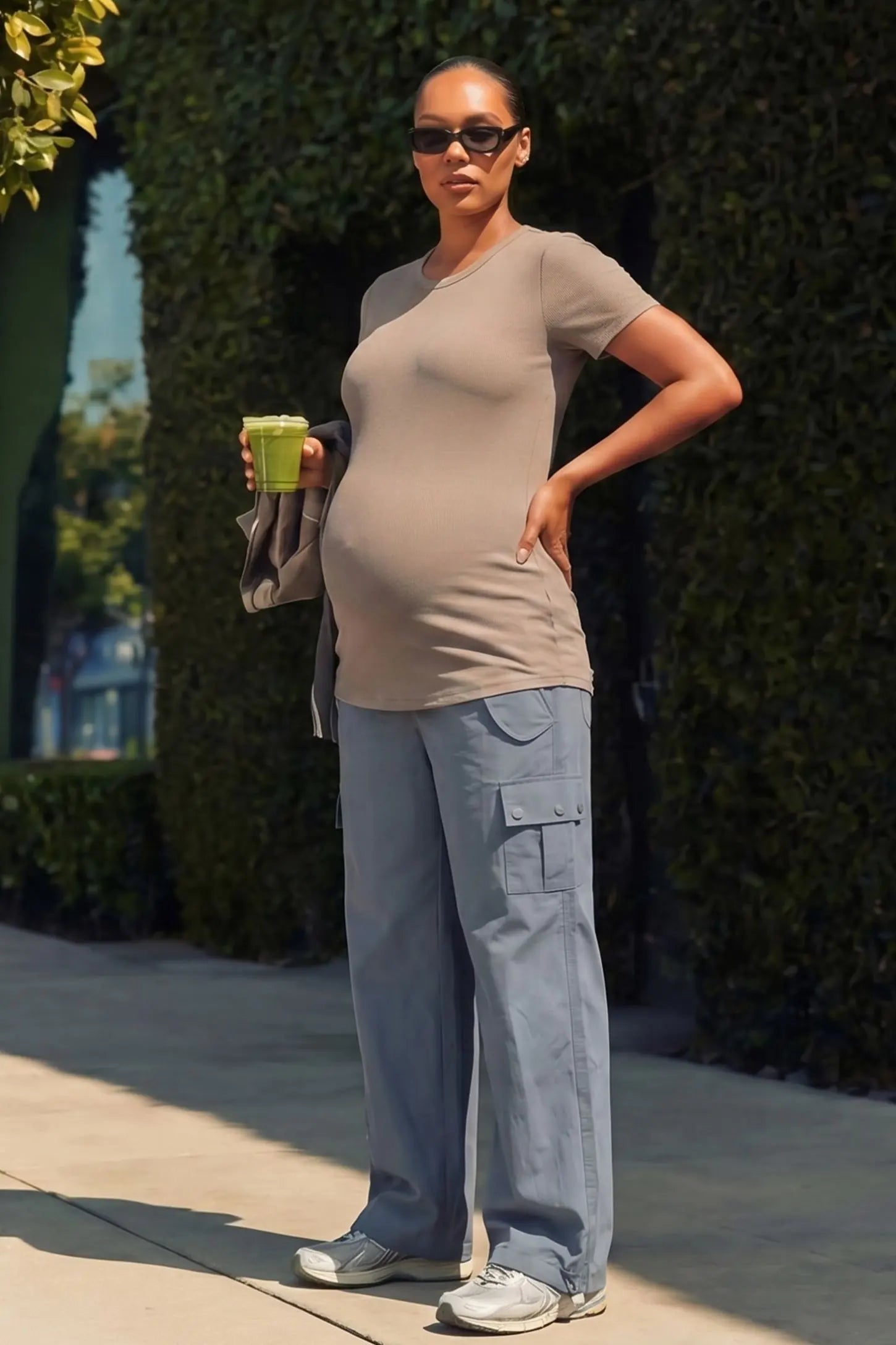 Ice Silk Cargo Maternity Pants Ice Silk Cargo Maternity Pants in gray featuring full belly panel, cargo pockets, and relaxed full-length fit on pregnant model front view.