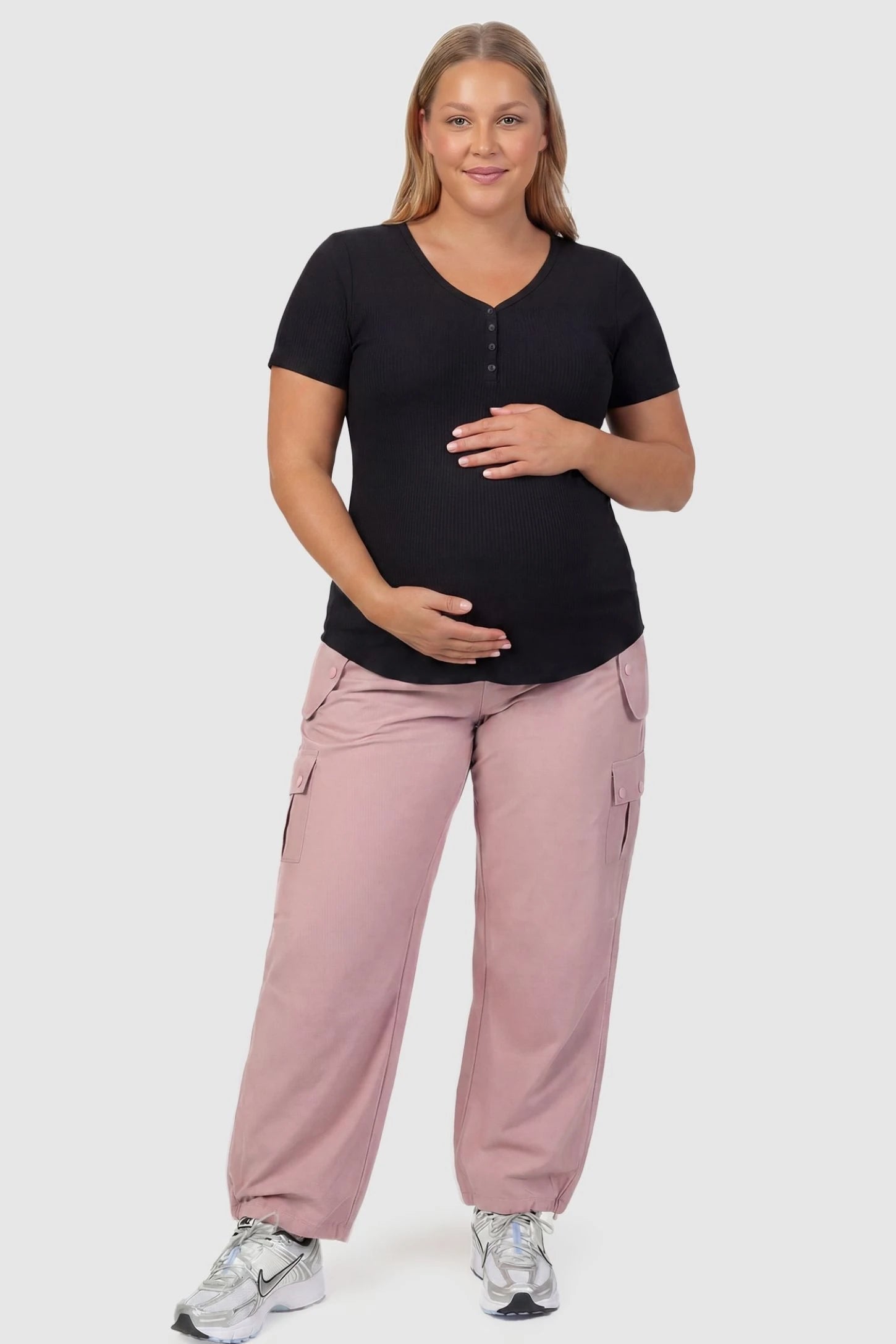 Ice Silk Cargo Maternity Pants Ice Silk Cargo Maternity Pants in pink featuring full belly panel, cargo pockets, and relaxed full-length fit on plus size pregnant model front view.