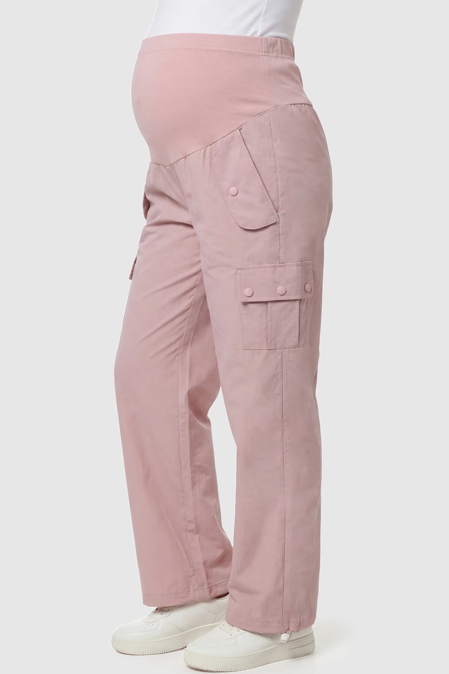 Ice Silk Cargo Maternity Pants Ice Silk Cargo Maternity Pants in pink featuring full belly panel, cargo pockets, and relaxed full-length fit on pregnant model side view.