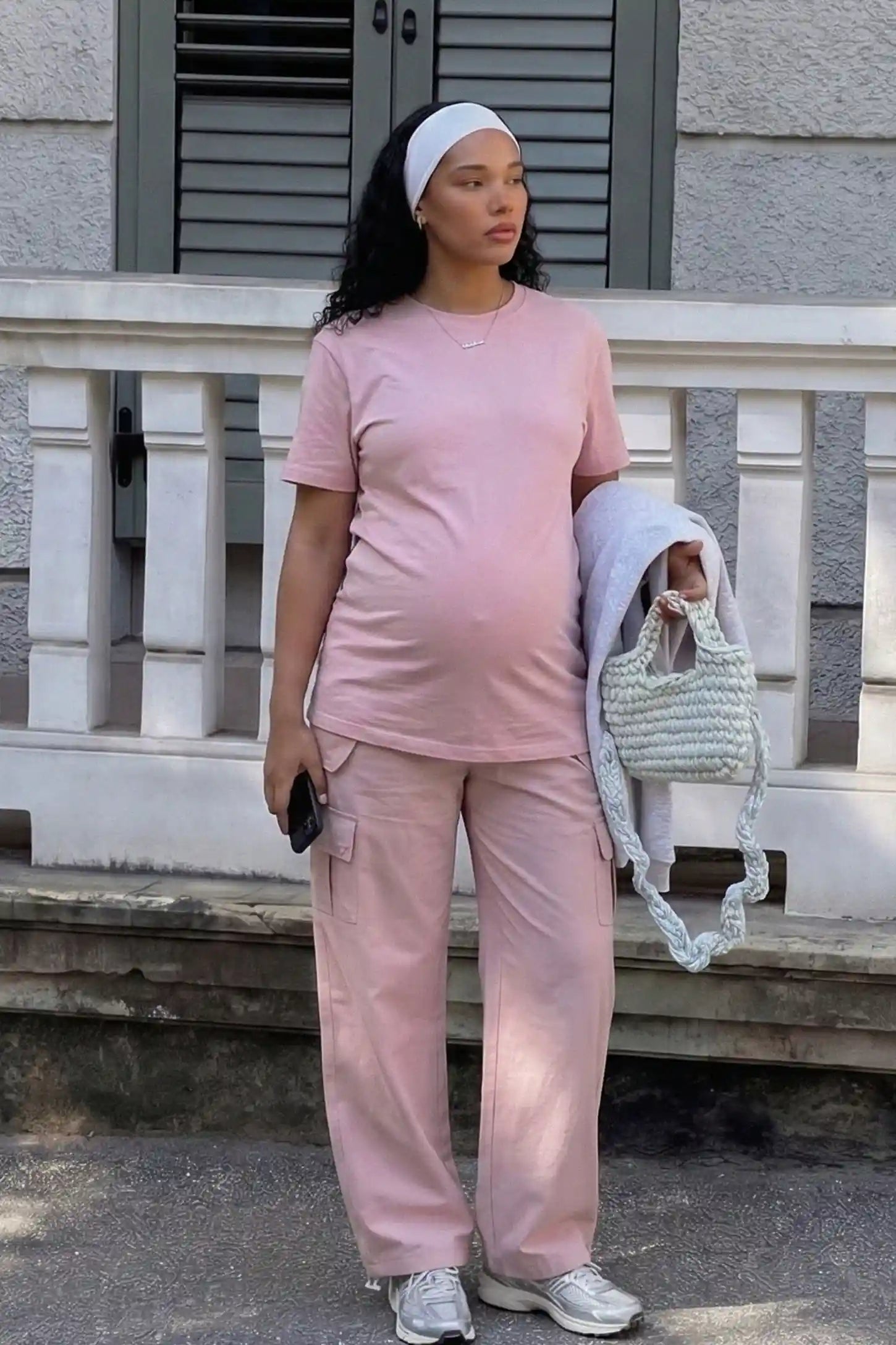 Ice Silk Cargo Maternity Pants Ice Silk Cargo Maternity Pants in pink featuring full belly panel, cargo pockets, and relaxed full-length fit on pregnant model front view.