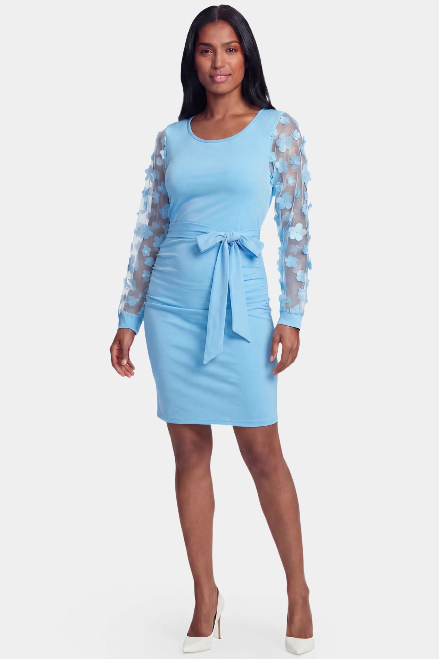 Sheer Long-Sleeve Tie-Waist Short Maternity Dress Sheer long-sleeve tie-waist short maternity dress in light blue featuring waist sash in front view on a postpartum model