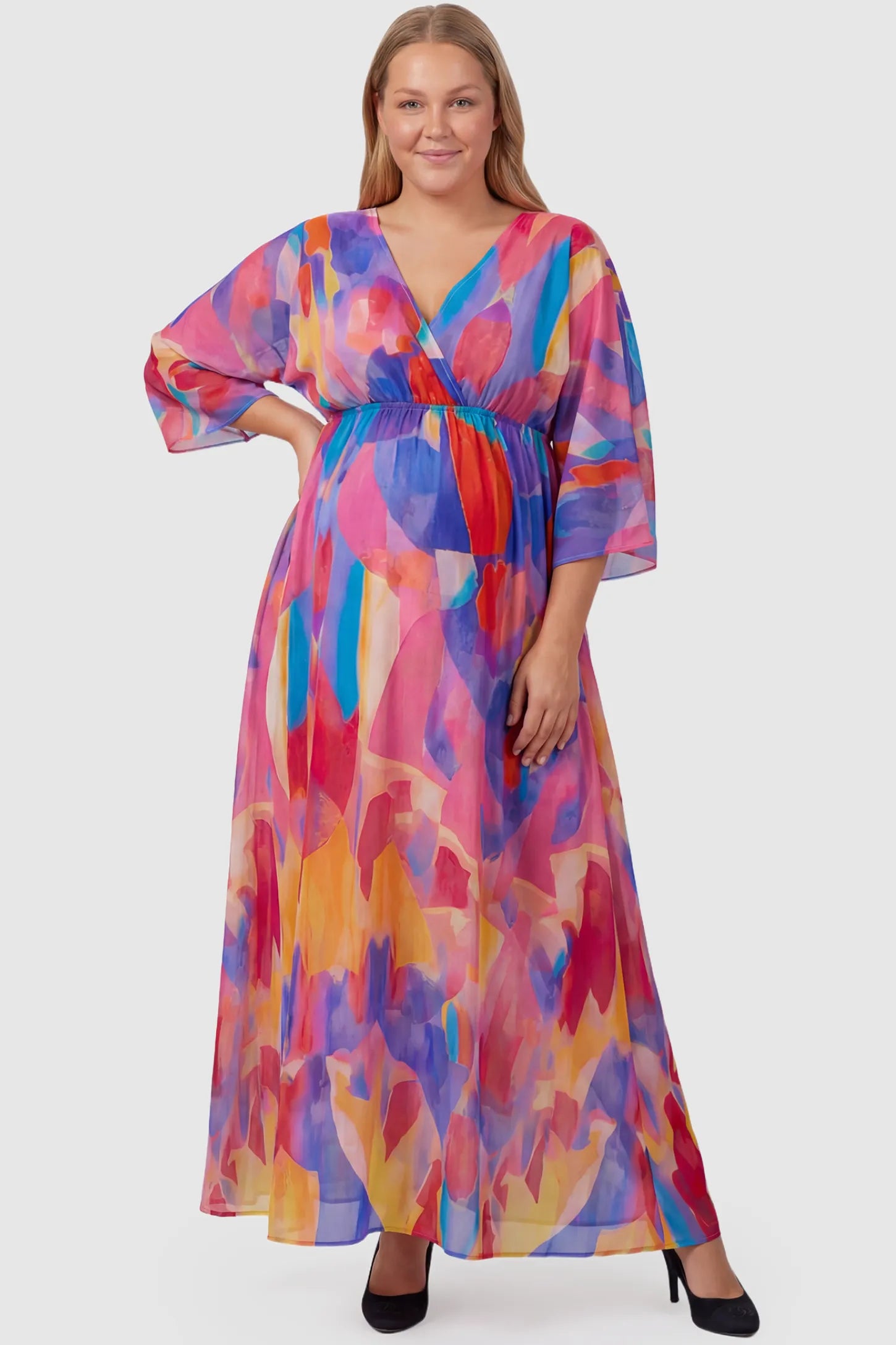 Abstract Print V-Neck Empire Waist Maxi Maternity Dress Abstract print V-neck empire waist maxi maternity dress in multicolor with flowing chiffon, full body on plus-size model