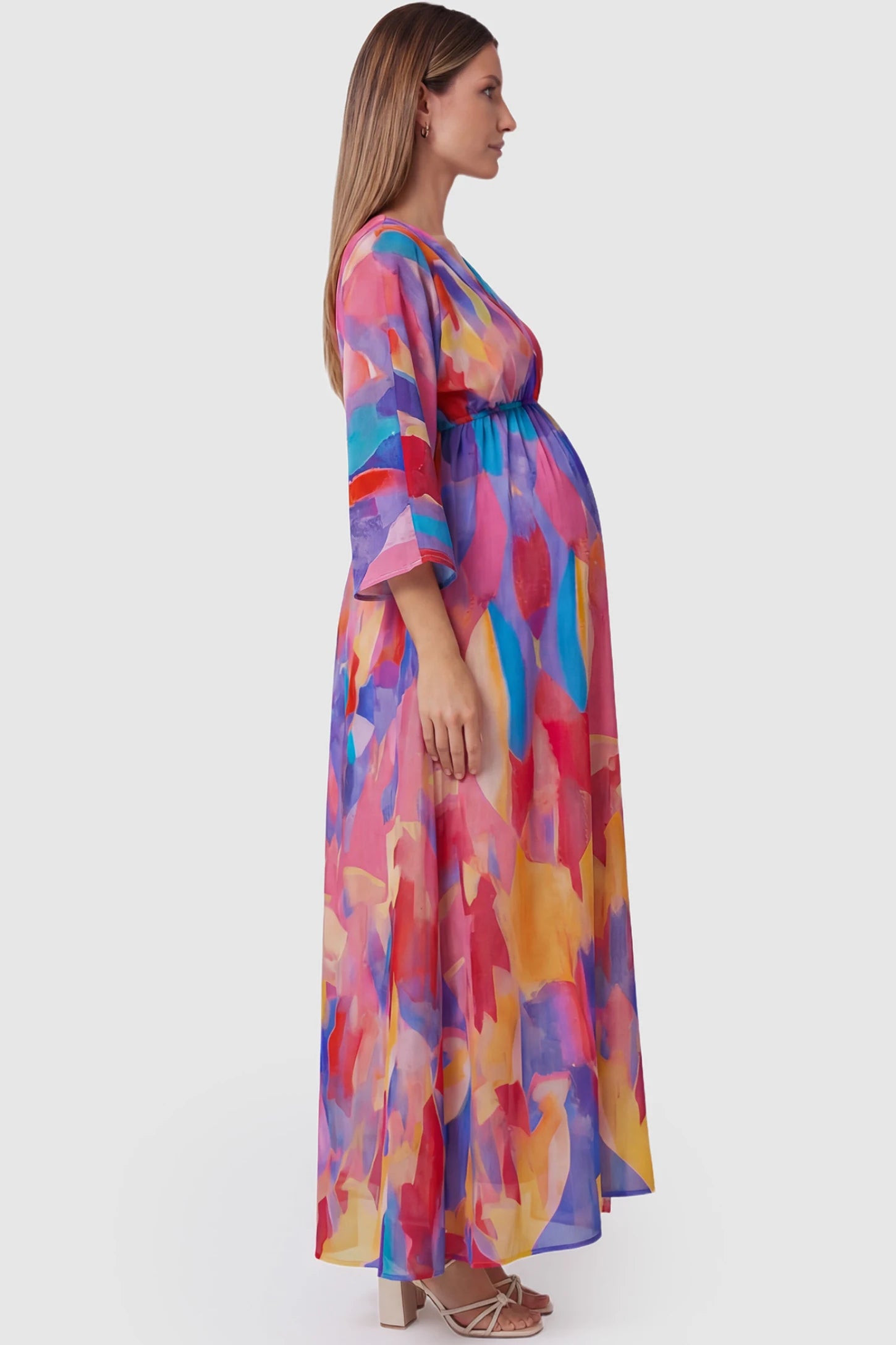 Abstract print V-neck empire waist maxi maternity dress in multicolor with empire waist, side view on pregnant model