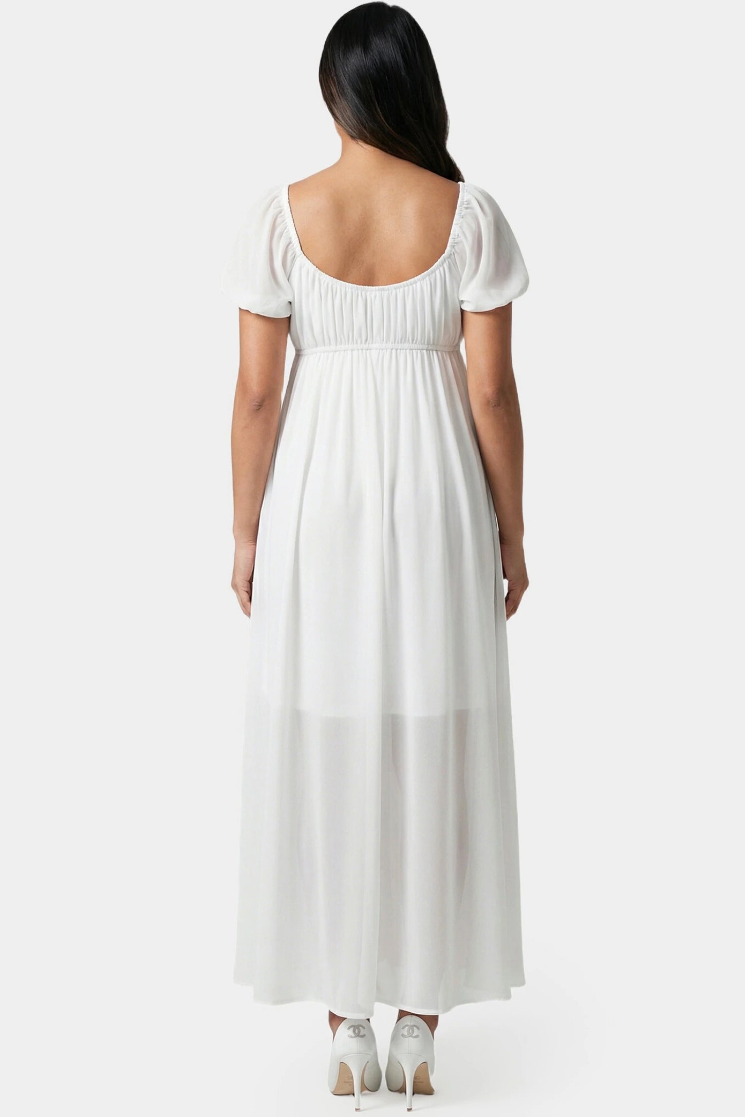 Chiffon Puff Sleeve Scoop Neck Maxi Maternity Dress Chiffon Puff Sleeve Scoop Neck Maxi Maternity Dress in white featuring flowing full skirt in full body back view on a pregnant model