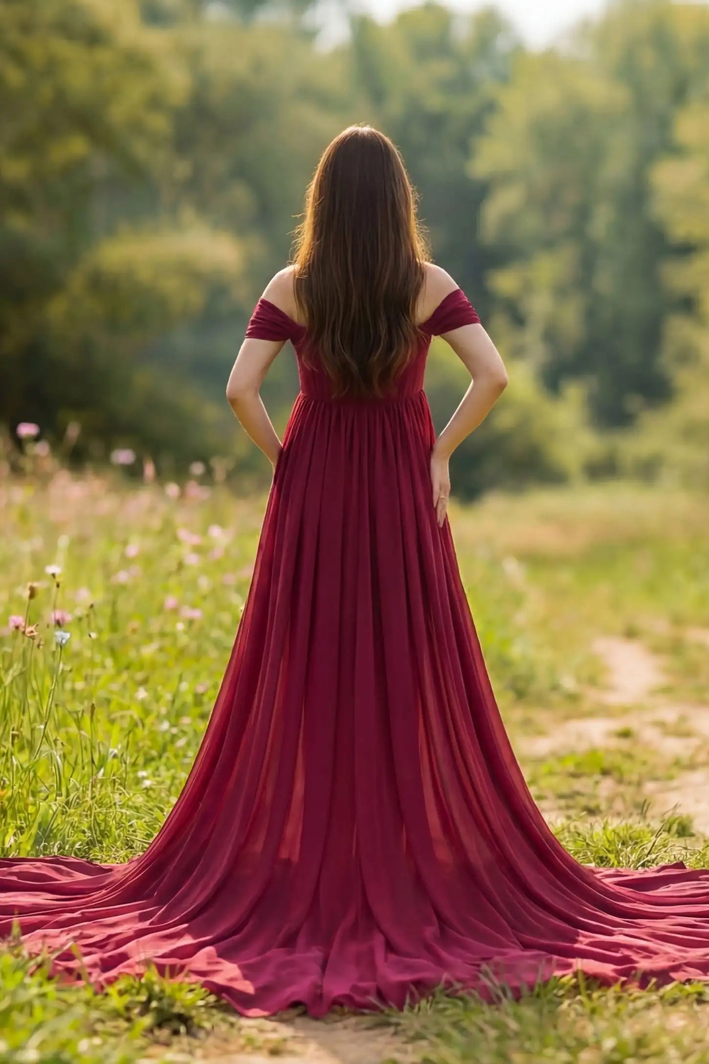 Chiffon-Finish Flowing Off-The-Shoulder Maternity Photoshoot Gown Back view of Burgundy Chiffon-Finish Flowing Off-The-Shoulder Maternity Photoshoot Gown featuring a long train on a pregnant model.