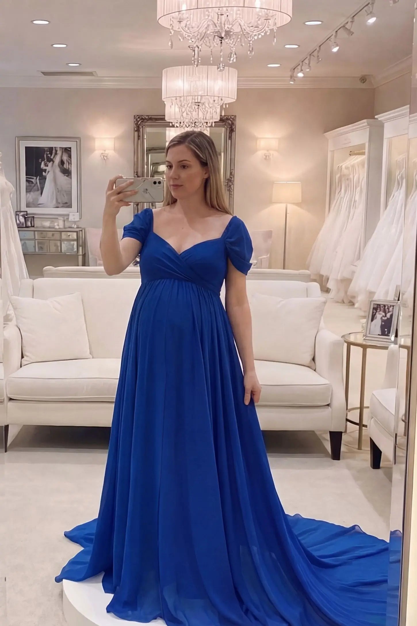 Chiffon-Finish Flowing Off-The-Shoulder Maternity Photoshoot Gown Dark Blue Chiffon-Finish Flowing Off-The-Shoulder Maternity Photoshoot Gown featuring an empire waist on a pregnant model.