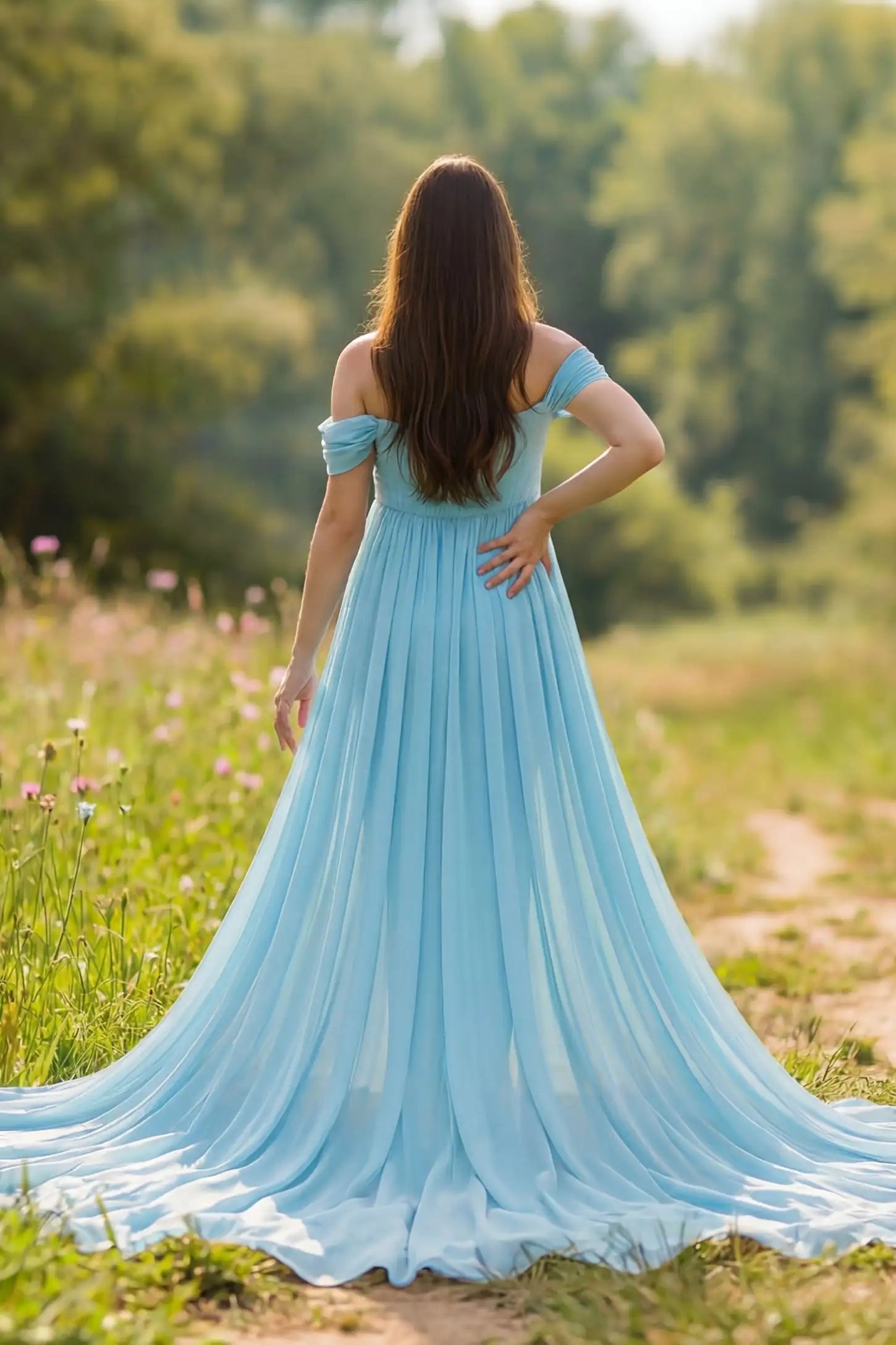 Chiffon-Finish Flowing Off-The-Shoulder Maternity Photoshoot Gown Back view of Light Blue Chiffon-Finish Flowing Off-The-Shoulder Maternity Photoshoot Gown featuring a long train on a pregnant model.