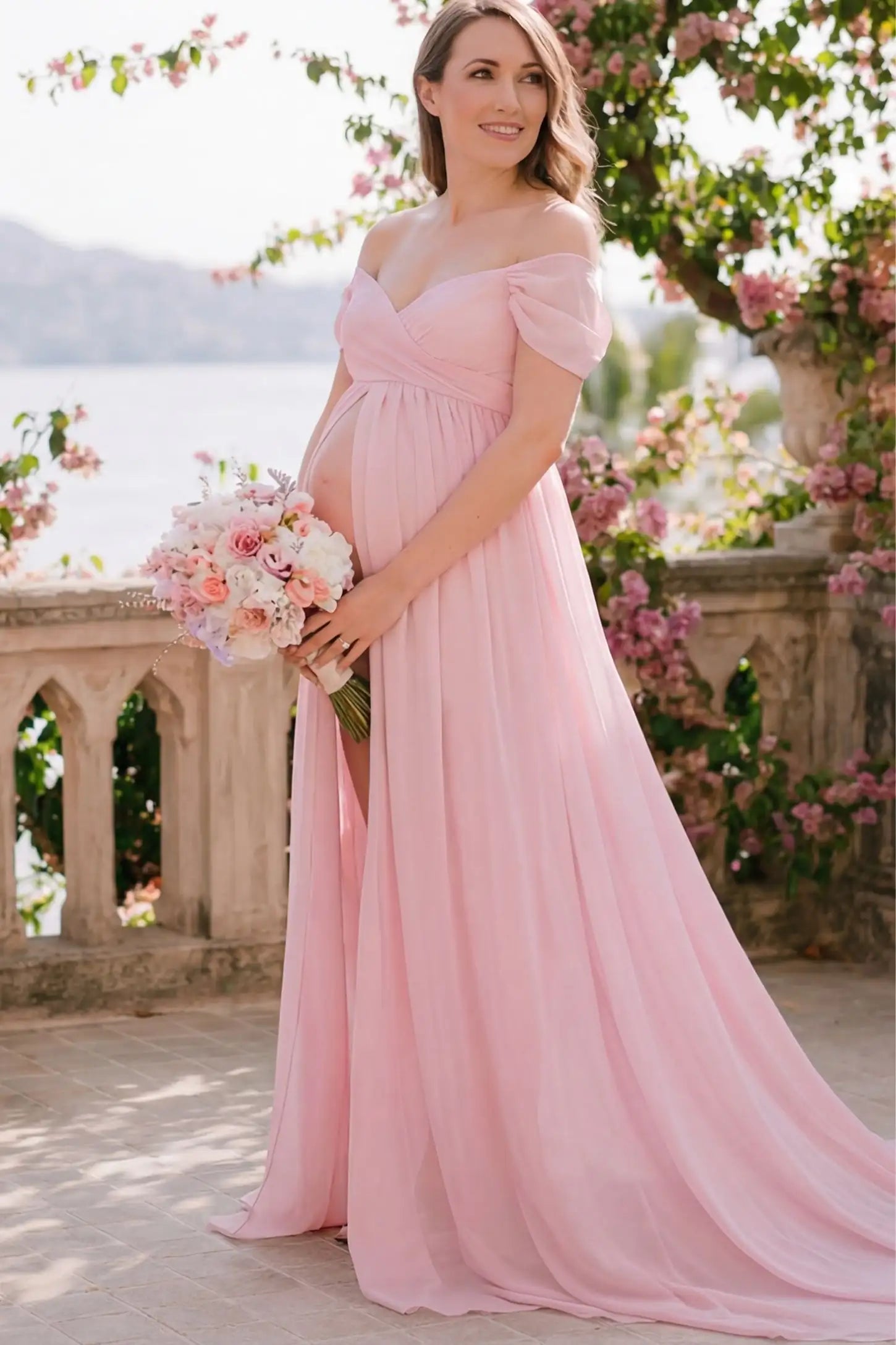 Chiffon-Finish Flowing Off-The-Shoulder Maternity Photoshoot Gown Pink Chiffon-Finish Flowing Off-The-Shoulder Maternity Photoshoot Gown featuring a sweetheart neck on a pregnant model outdoors.