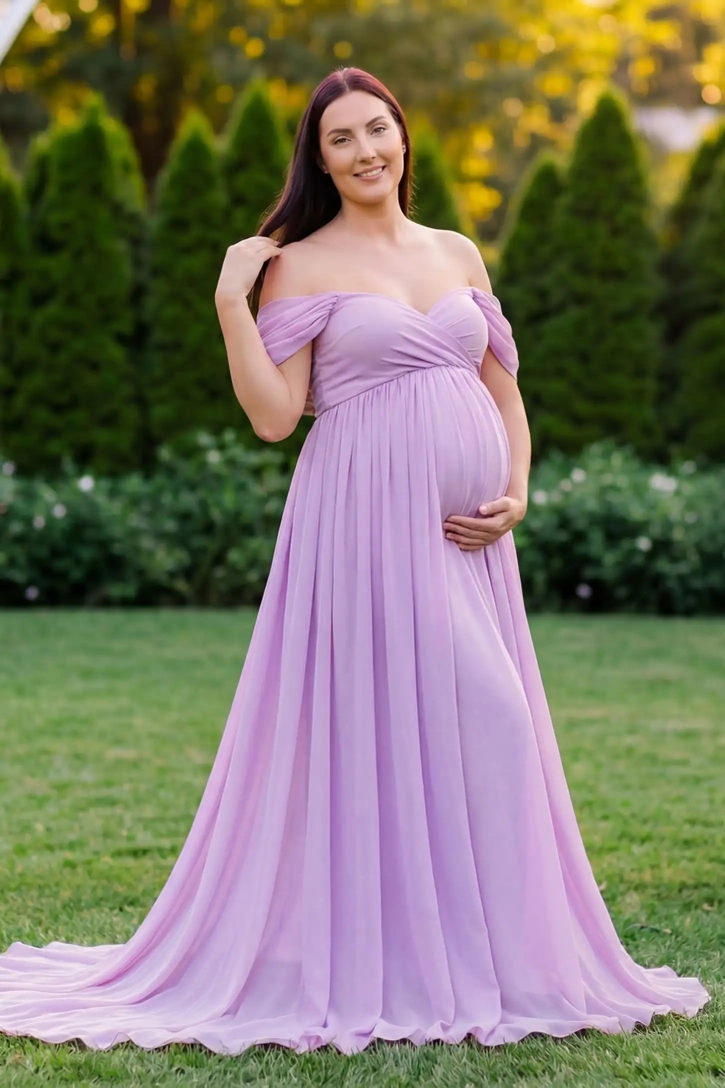 Chiffon-Finish Flowing Off-The-Shoulder Maternity Photoshoot Gown Purple Chiffon-Finish Flowing Off-The-Shoulder Maternity Photoshoot Gown featuring an empire waist on a pregnant model.