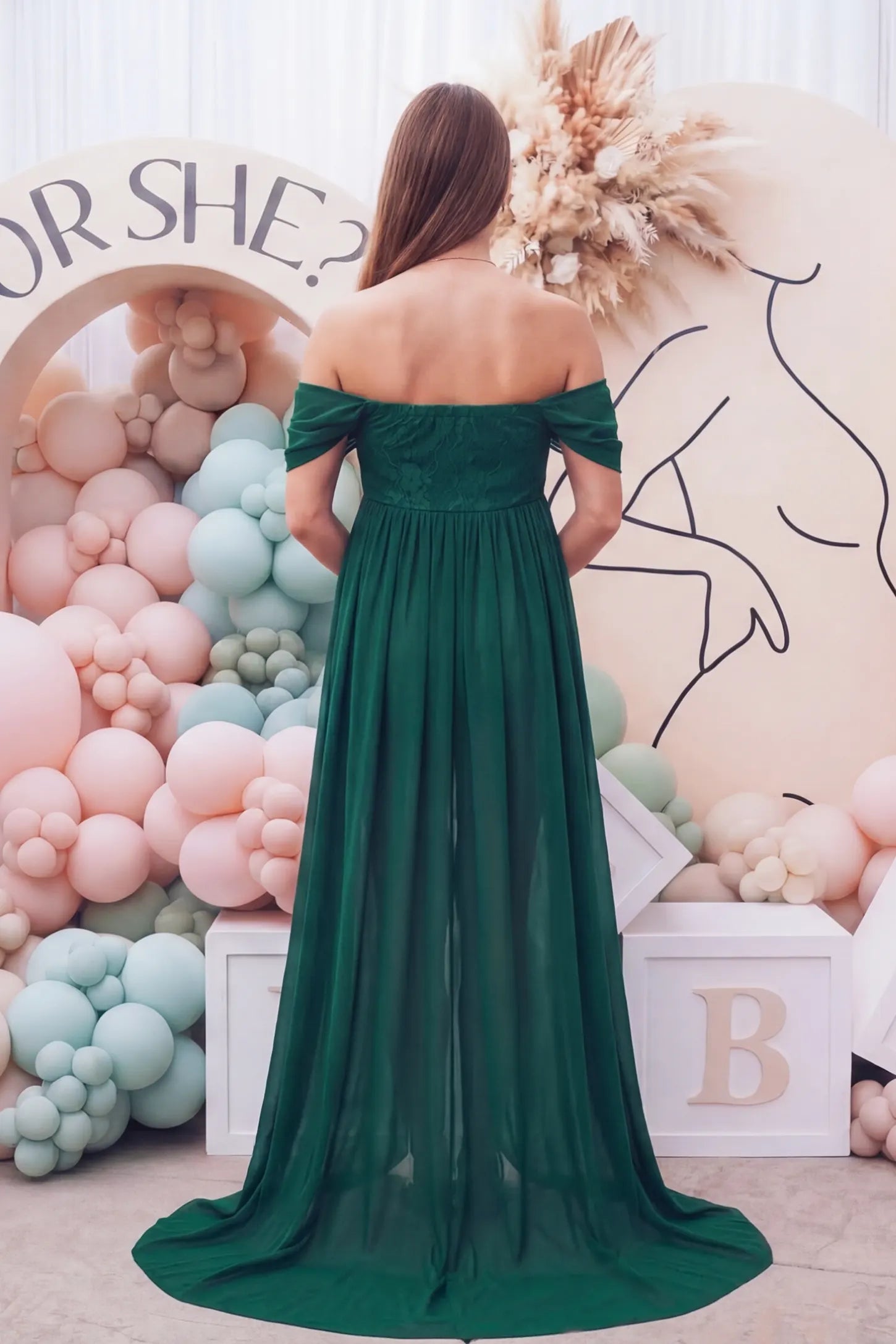 Chiffon Split-Front Maxi Maternity Photoshoot Gown Chiffon Split-Front Maxi Maternity Photoshoot Dress in Green featuring a cinched elastic back on a rearview pregnant model.