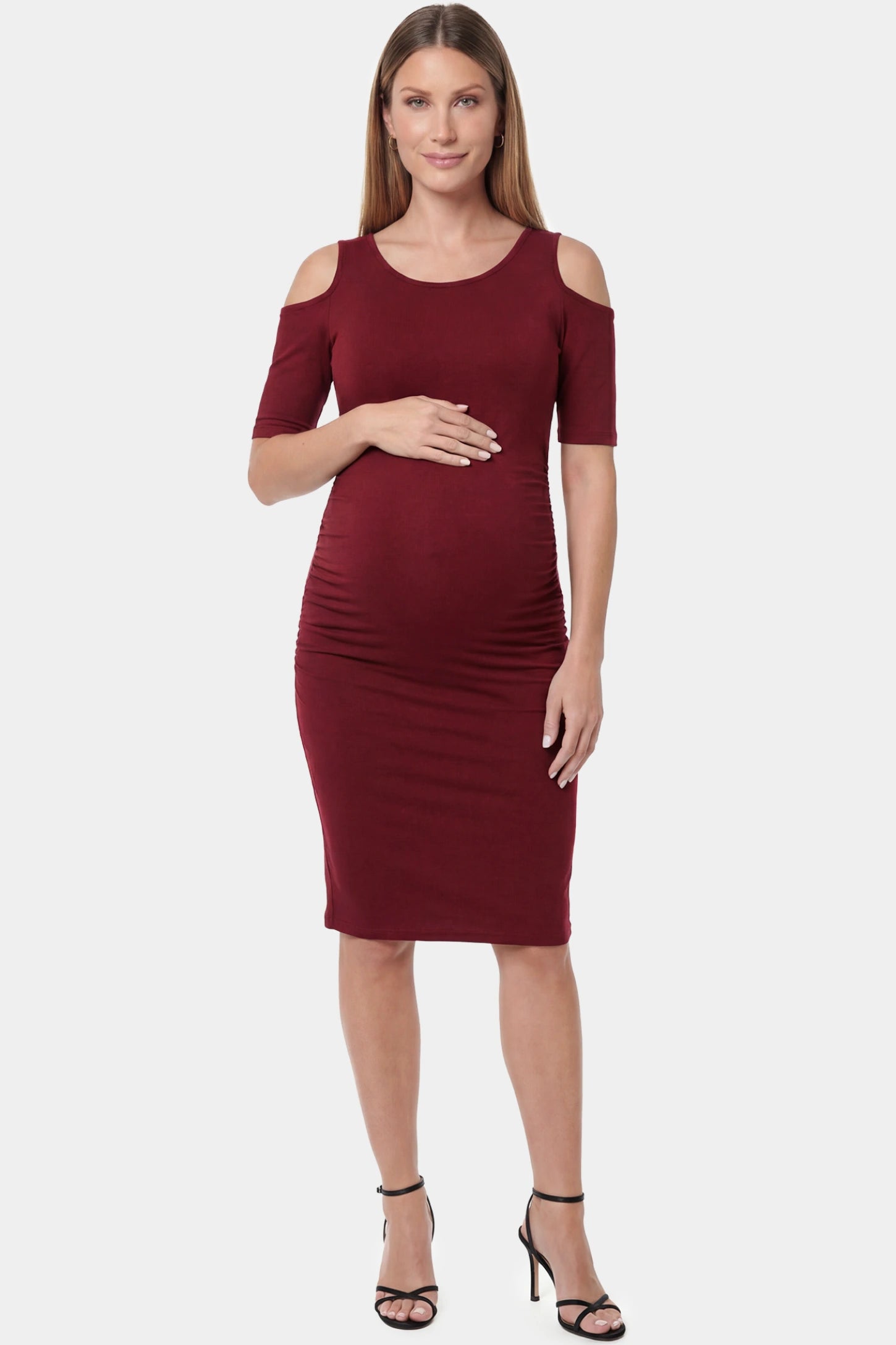 Cold Shoulder Sleeve Fitted Short Maternity Dress Cold shoulder sleeve fitted short maternity dress in burgundy featuring soft stretch fabric in full body front view on a pregnant model
